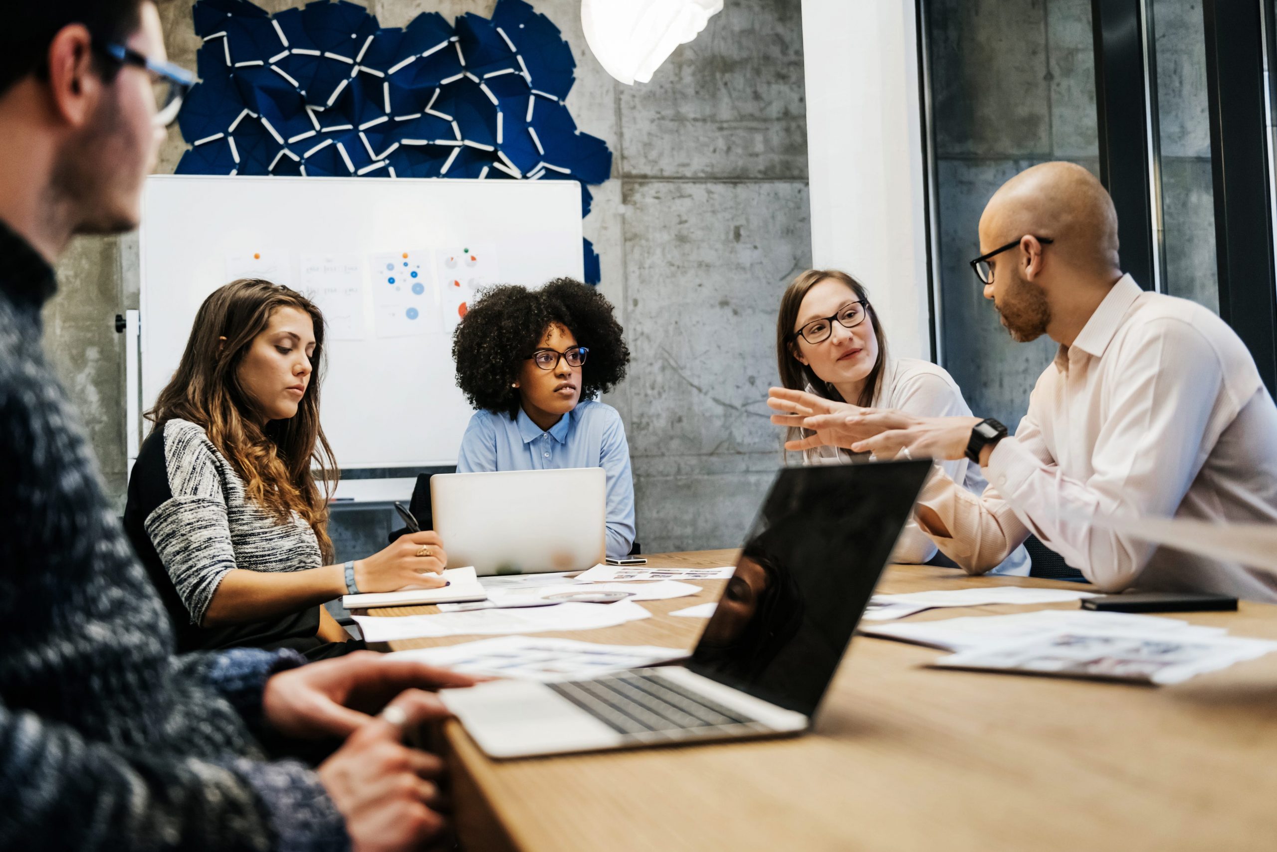 people sitting in an office at a meeting