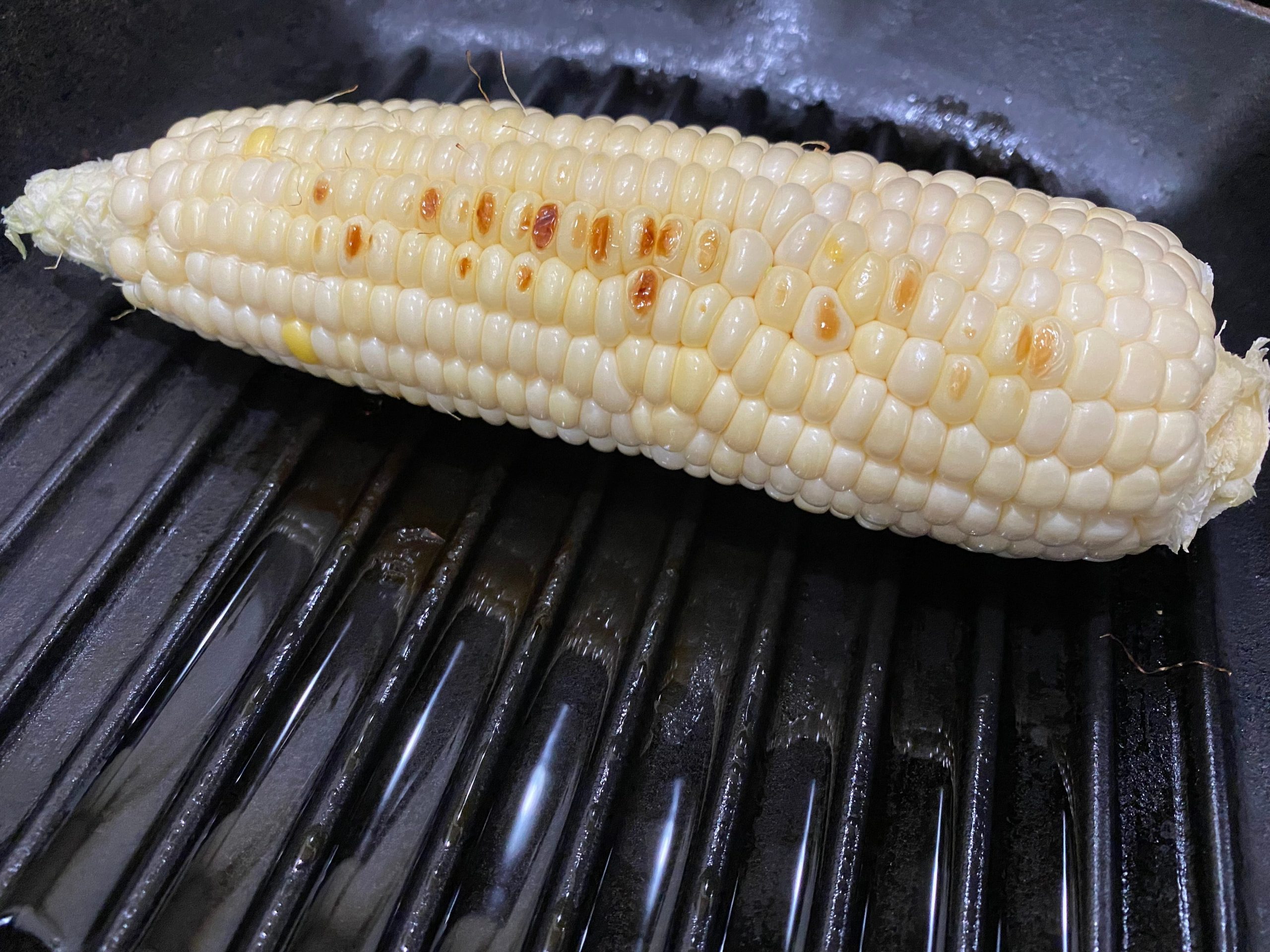 Corn on a grill.