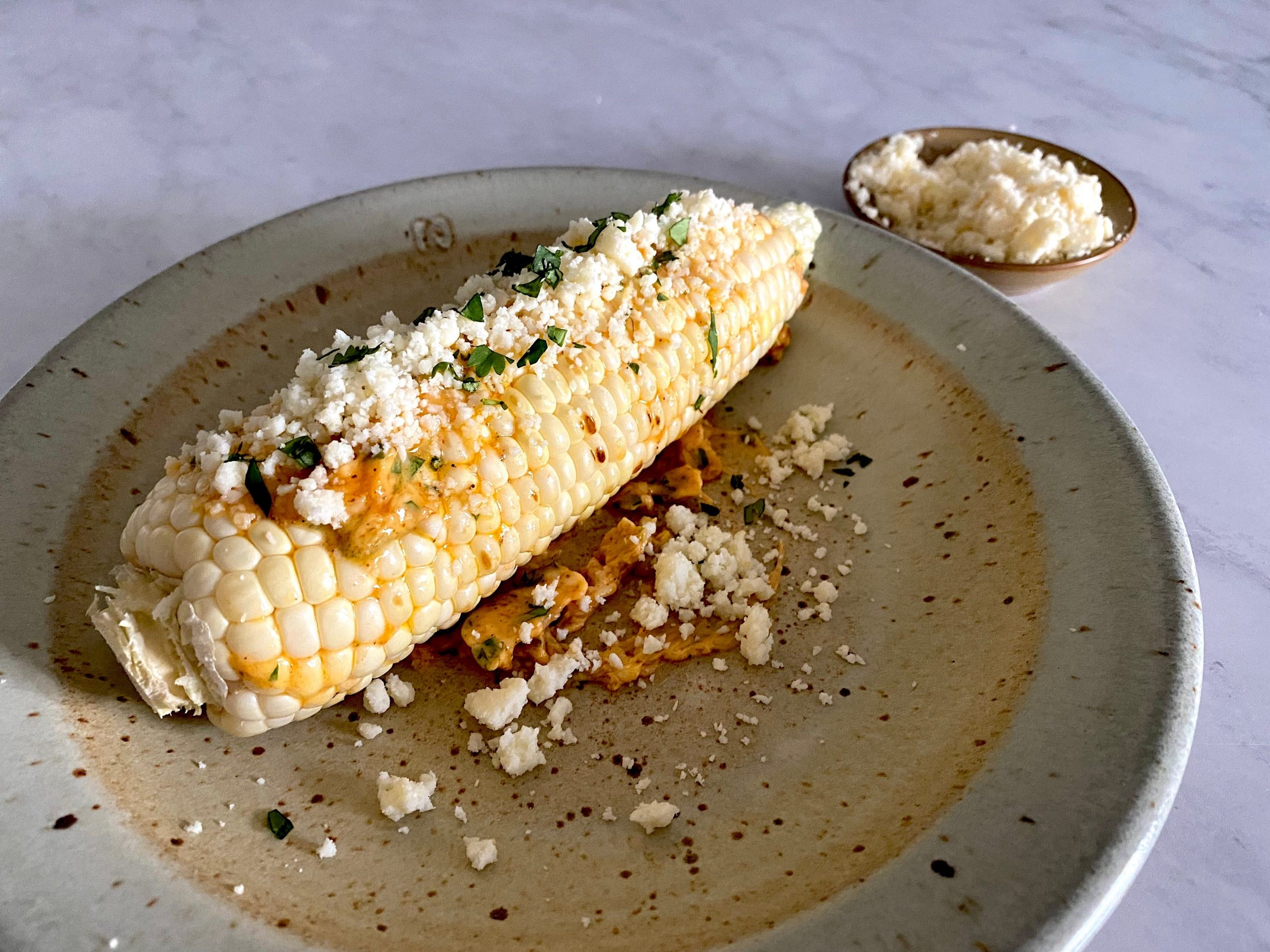 Corn on the cob with cilantro, lime, and rocoto.