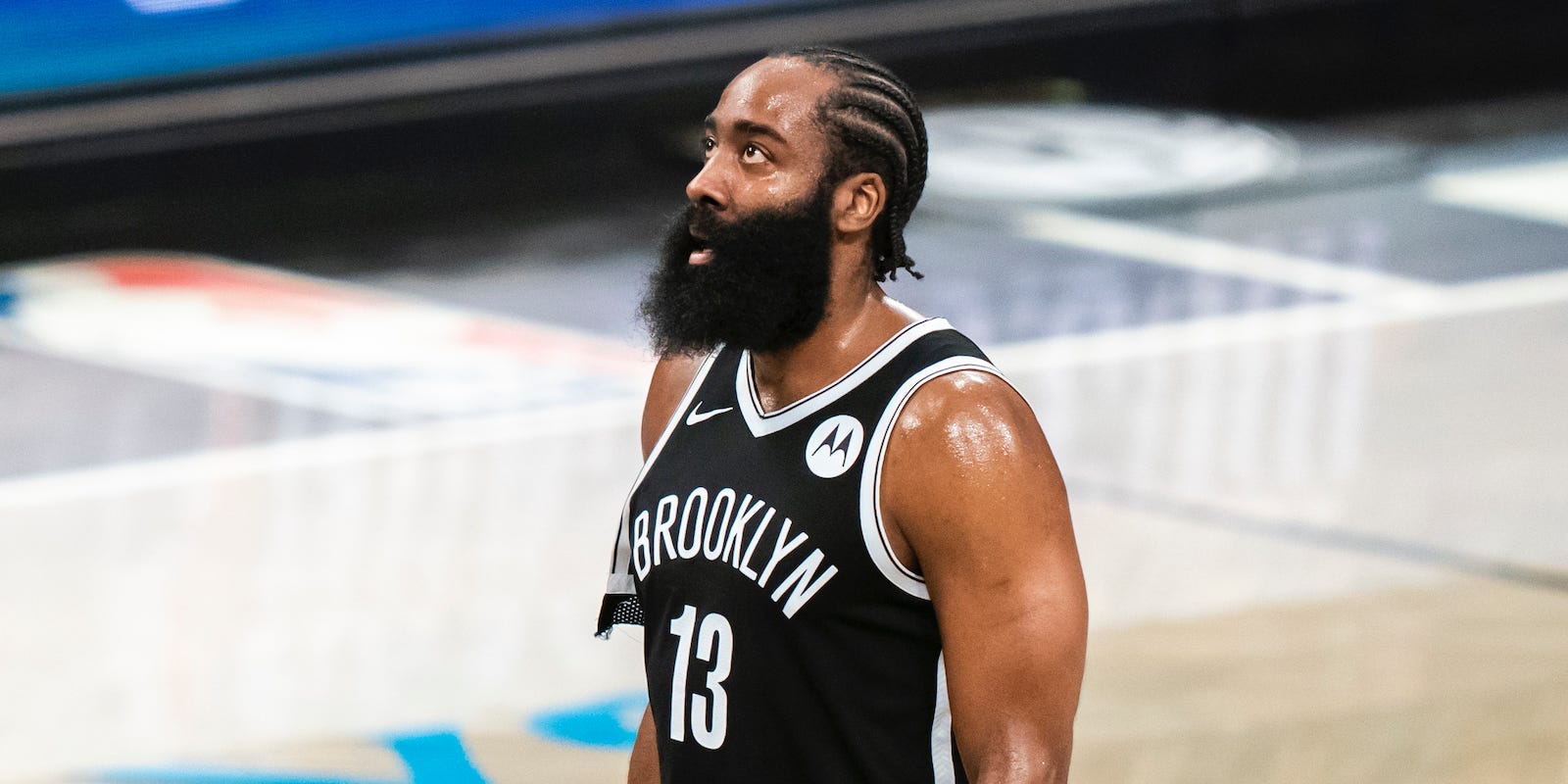 James Harden looks up during game in 2021.