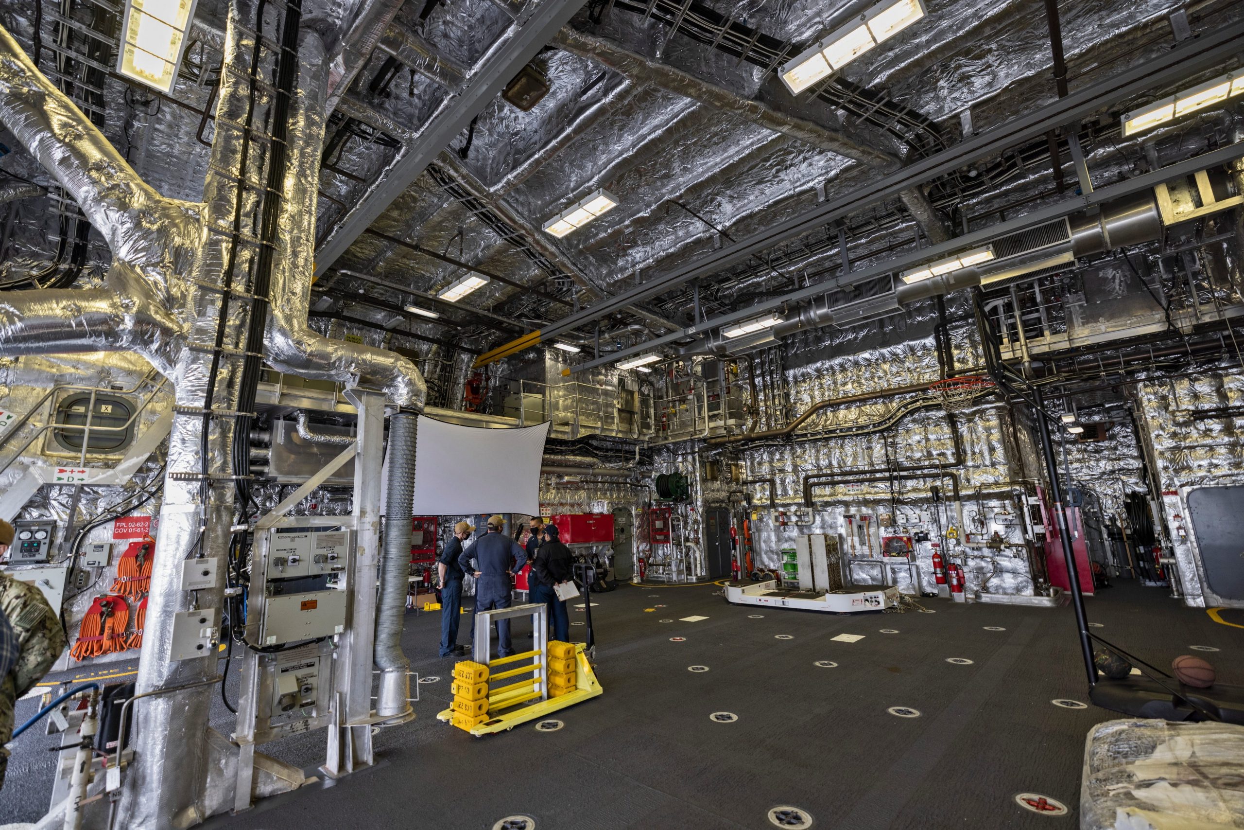 The lower deck, seen from the entrance, with the lights on.