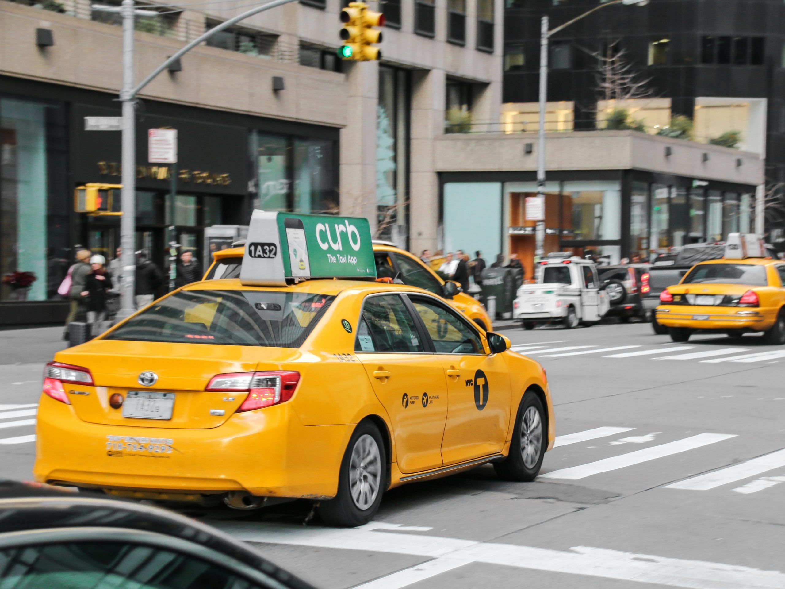 Taxi cabs drive through streets of Manhattan, NYC