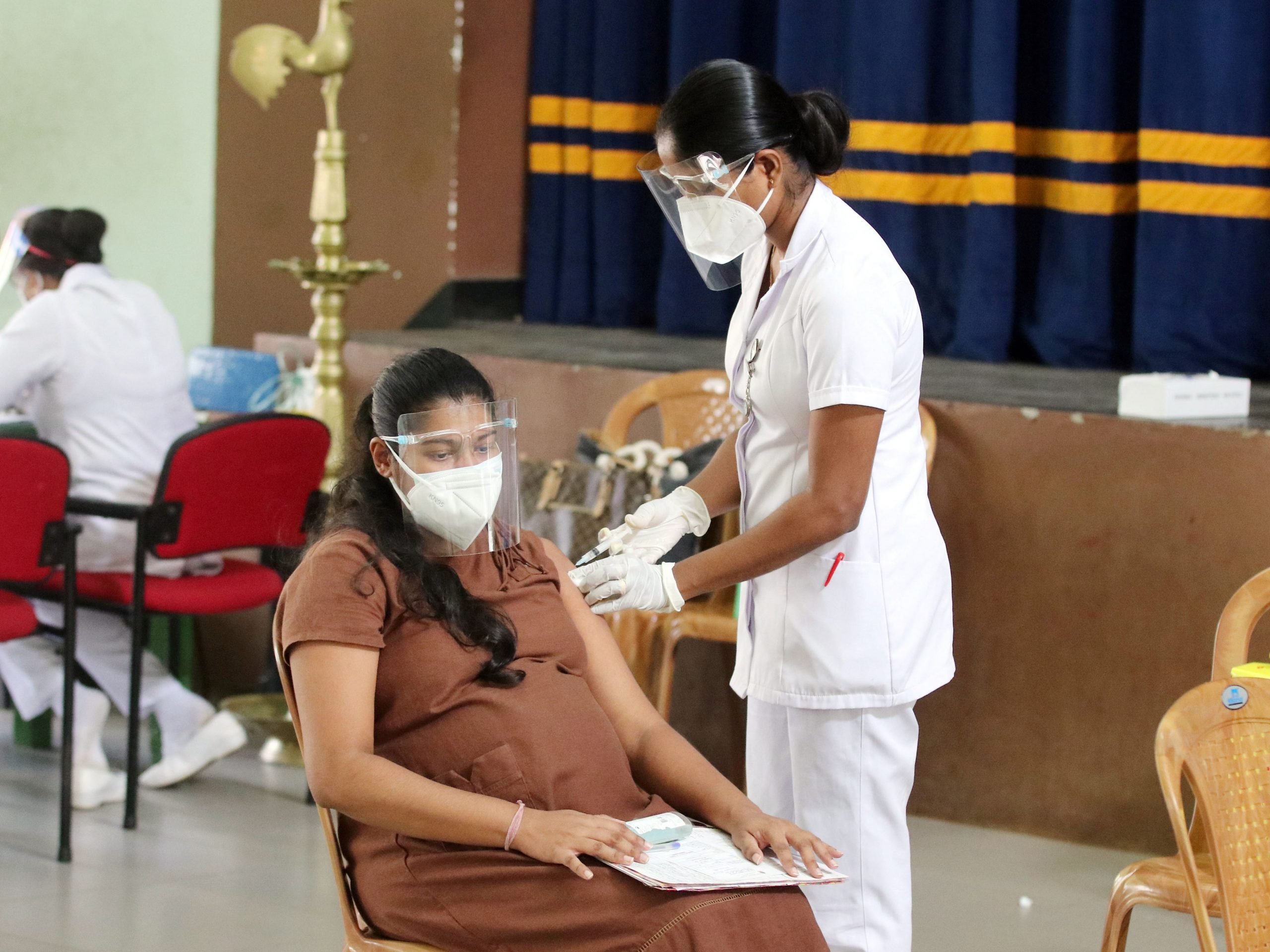 A pregnant mother receives the COVID-19 vaccine at a maternity clinic in Colombo, Sri Lanka, on Aug. 24, 2021.