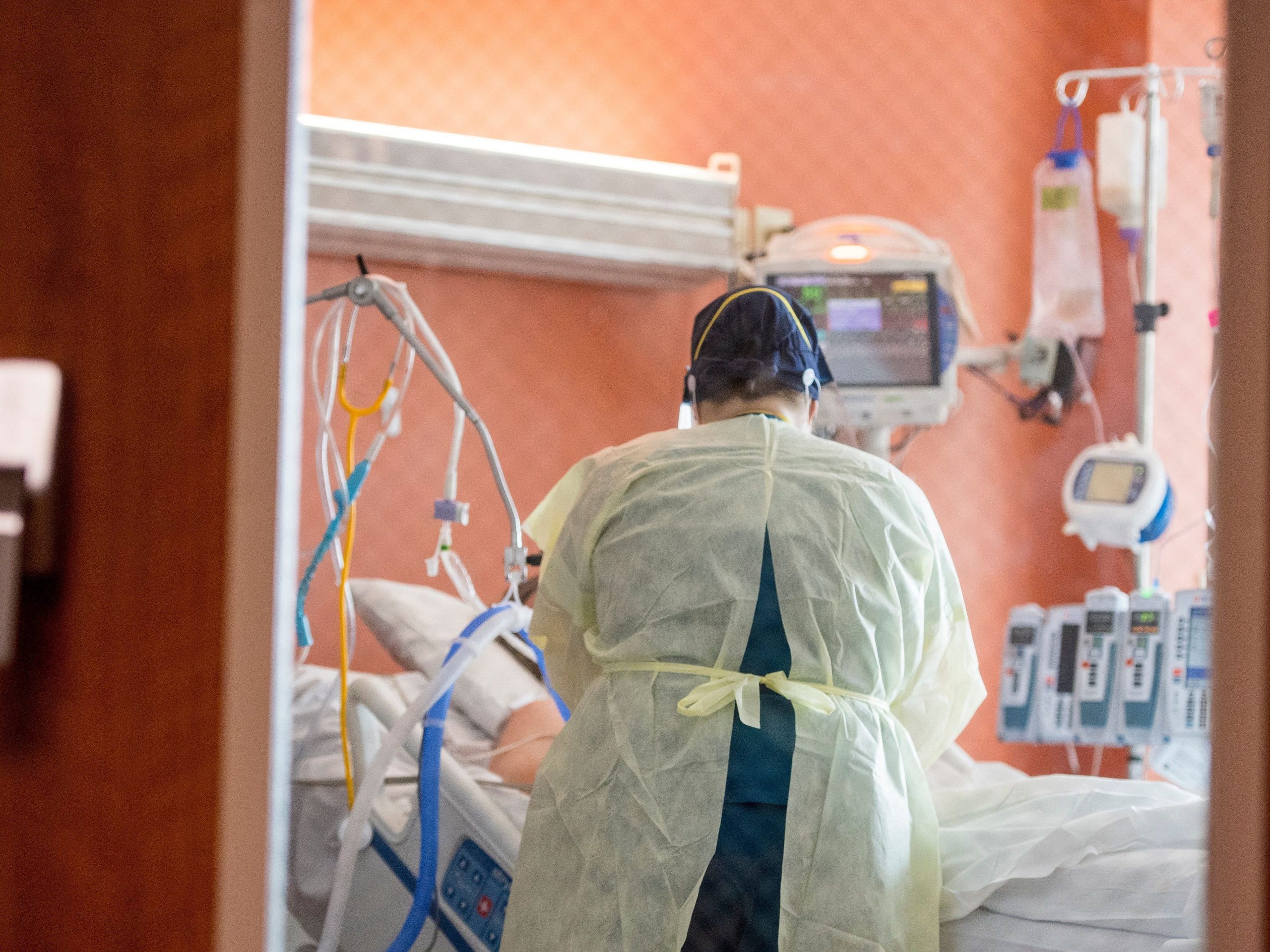 A nurse cares for a Covid-19 patient inside the ICU (intensive care unit) at Adventist Health in Sonora, California on August 27, 2021.