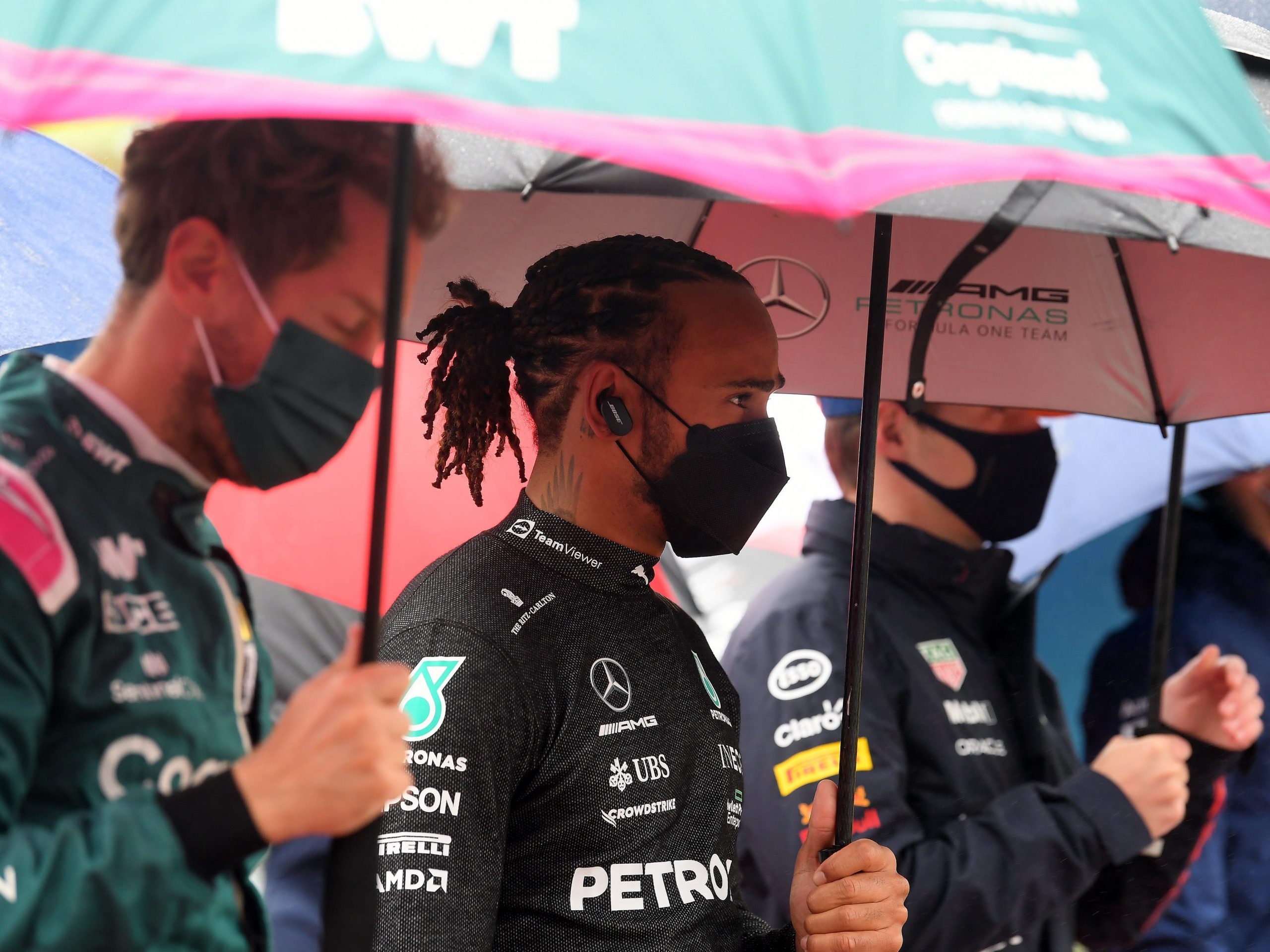 Lewis Hamilton stood an umbrella during the Belgian Grand Prix