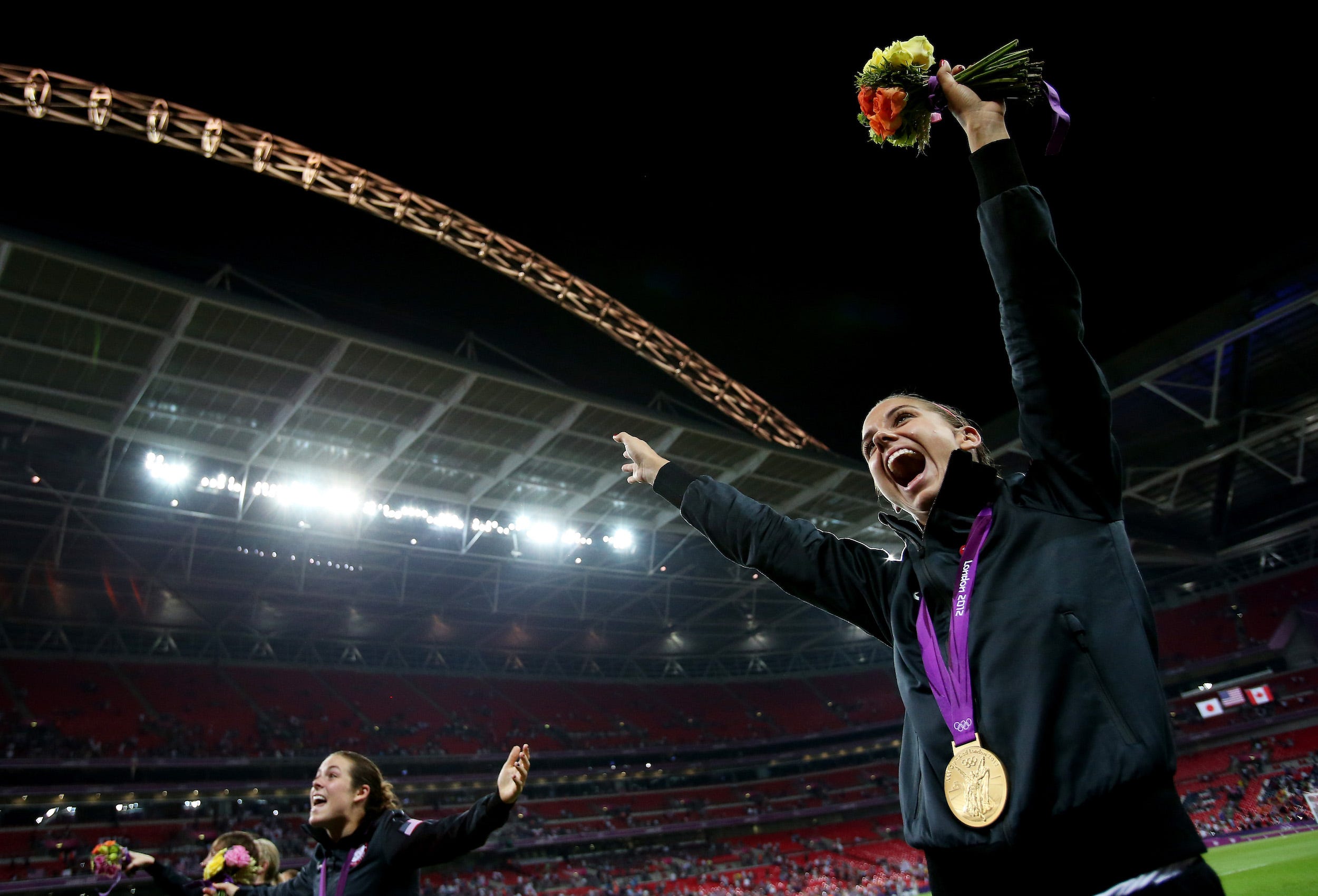Alex Morgan celebrates her gold medal at the 2012 London Olympics.