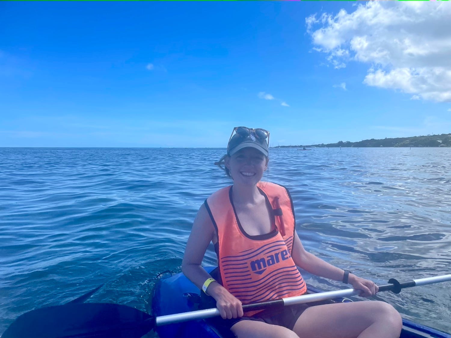 A blurry image of the author in her kayak.