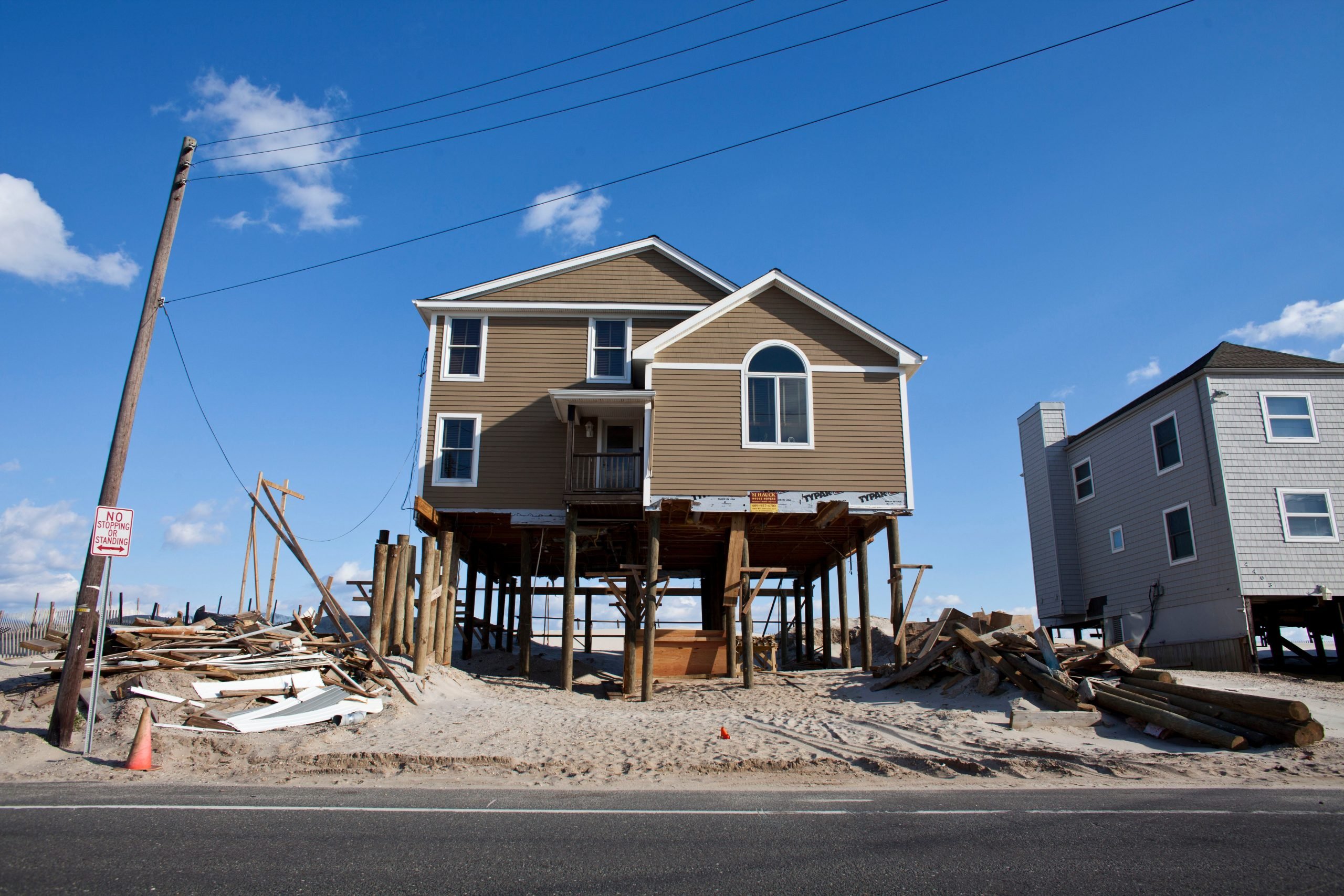 An elevated house rests on newly constructed pillings nearly a year after it was damaged by Hurricane Sandy