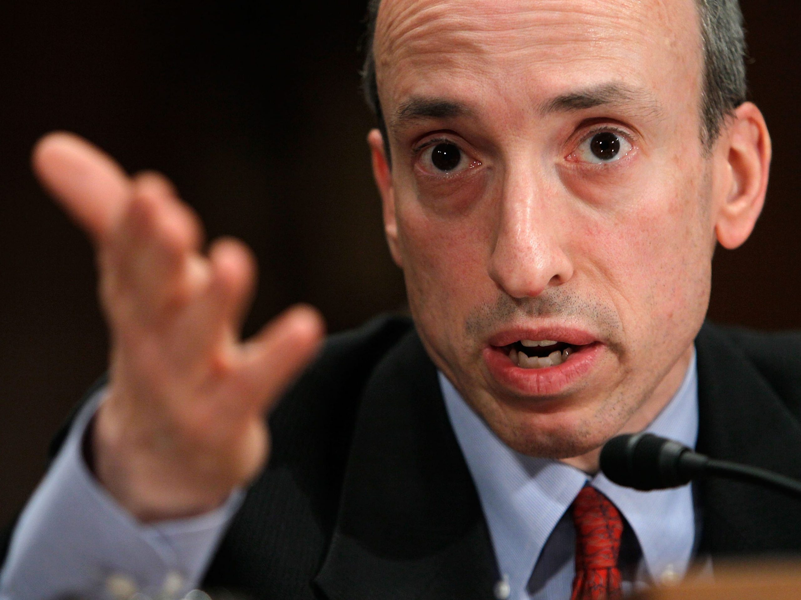 US Securities and Exchange Commission chairman Gary Gensler speaks into a microphone and gestures with his hand