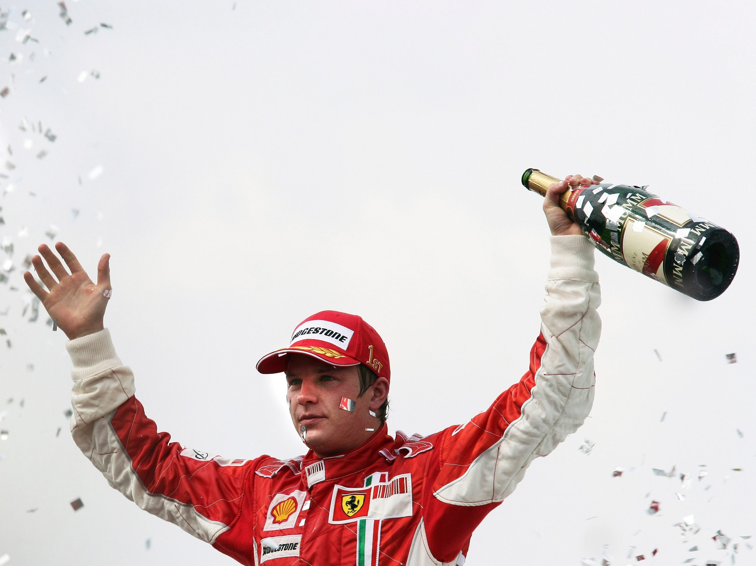 Kimi Raikkonen on the podium celebrating winning the 2007 Brazilian Grand Prix