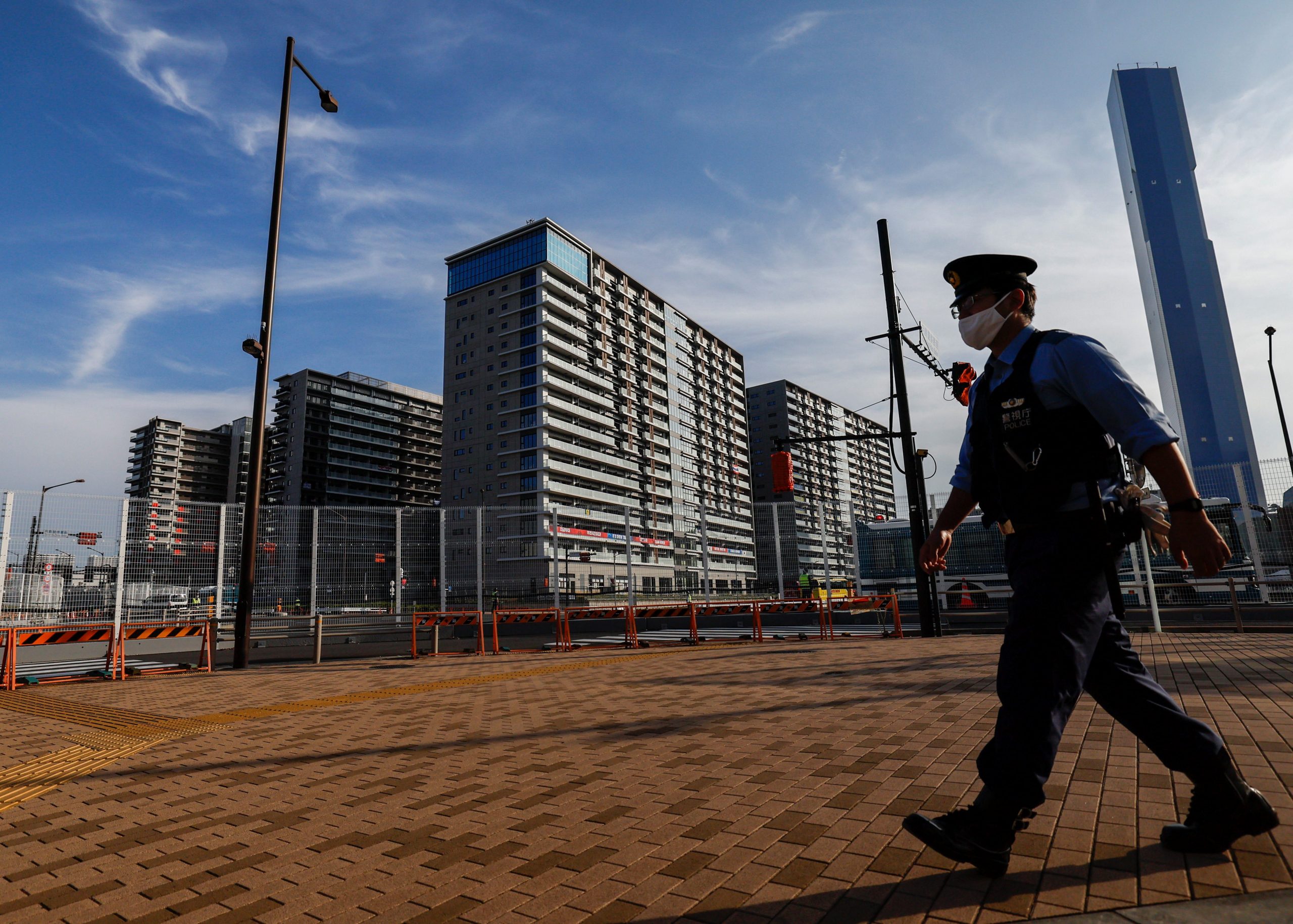 A police officer patrols at athletes' village for Tokyo 2020 Paralympic Games in Tokyo.