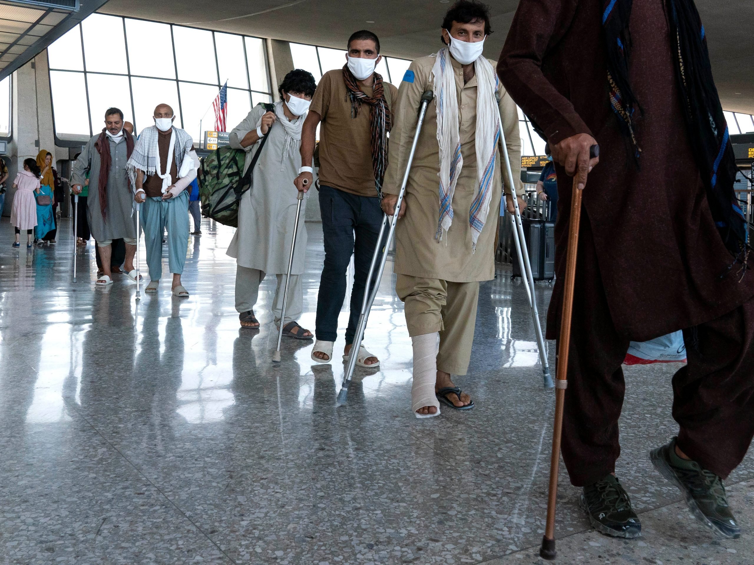 Injured Afghans arrive at Dulles International Airport.