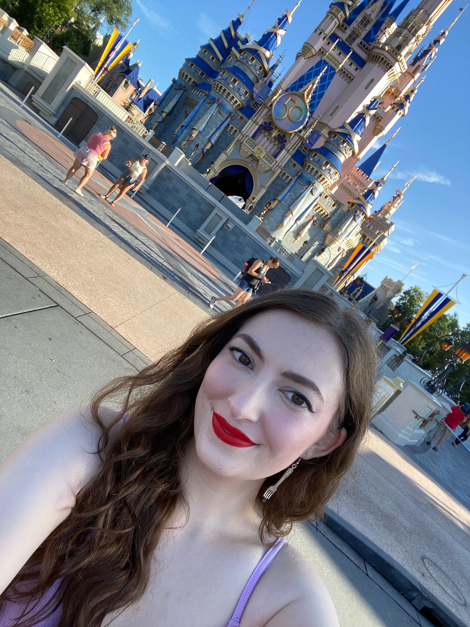 Insider reporter Amanda Krause takes a selfie in front of Disney World's Cinderella Castle.