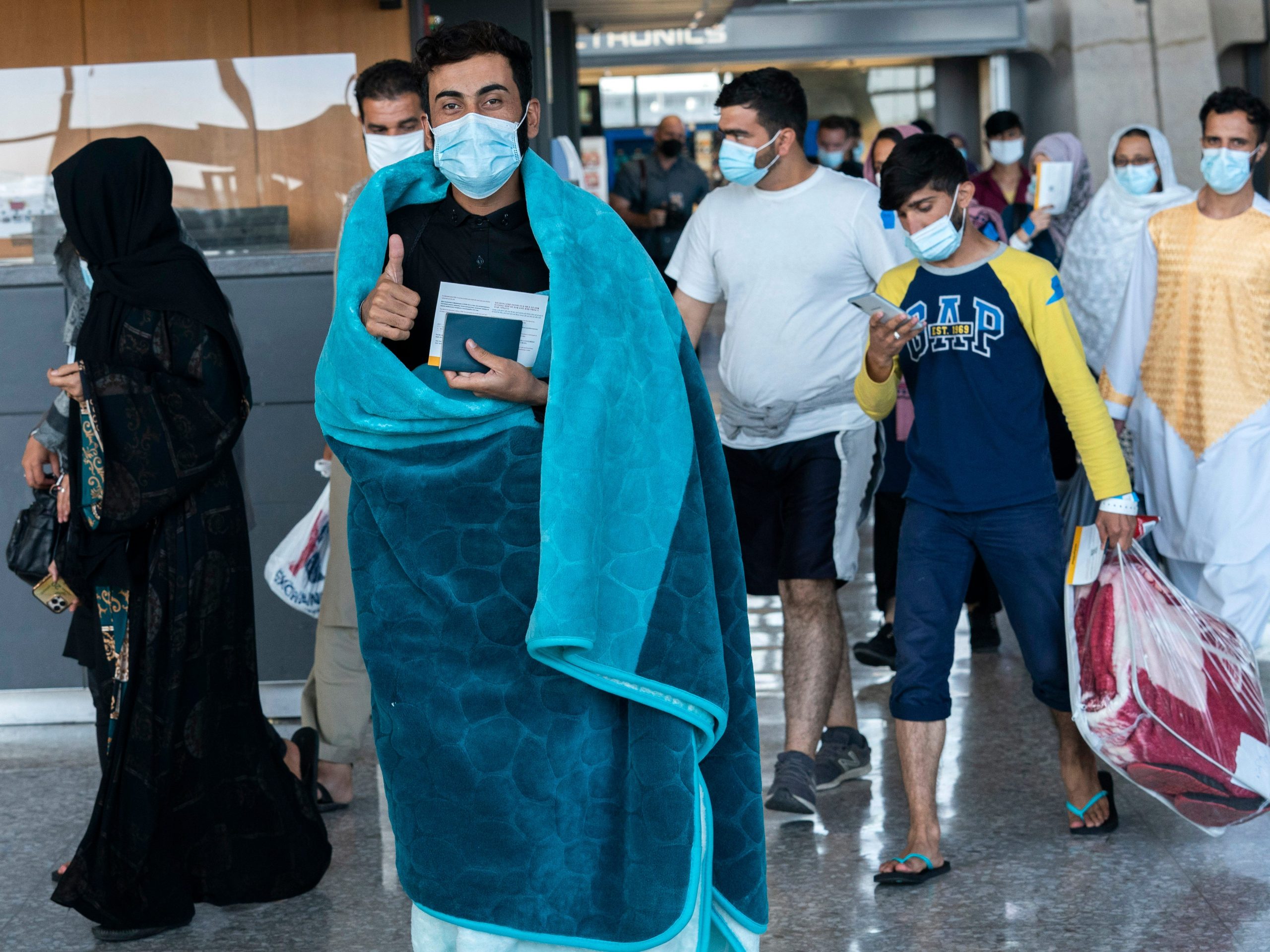 Afghans arrive at Dulles International Airport.