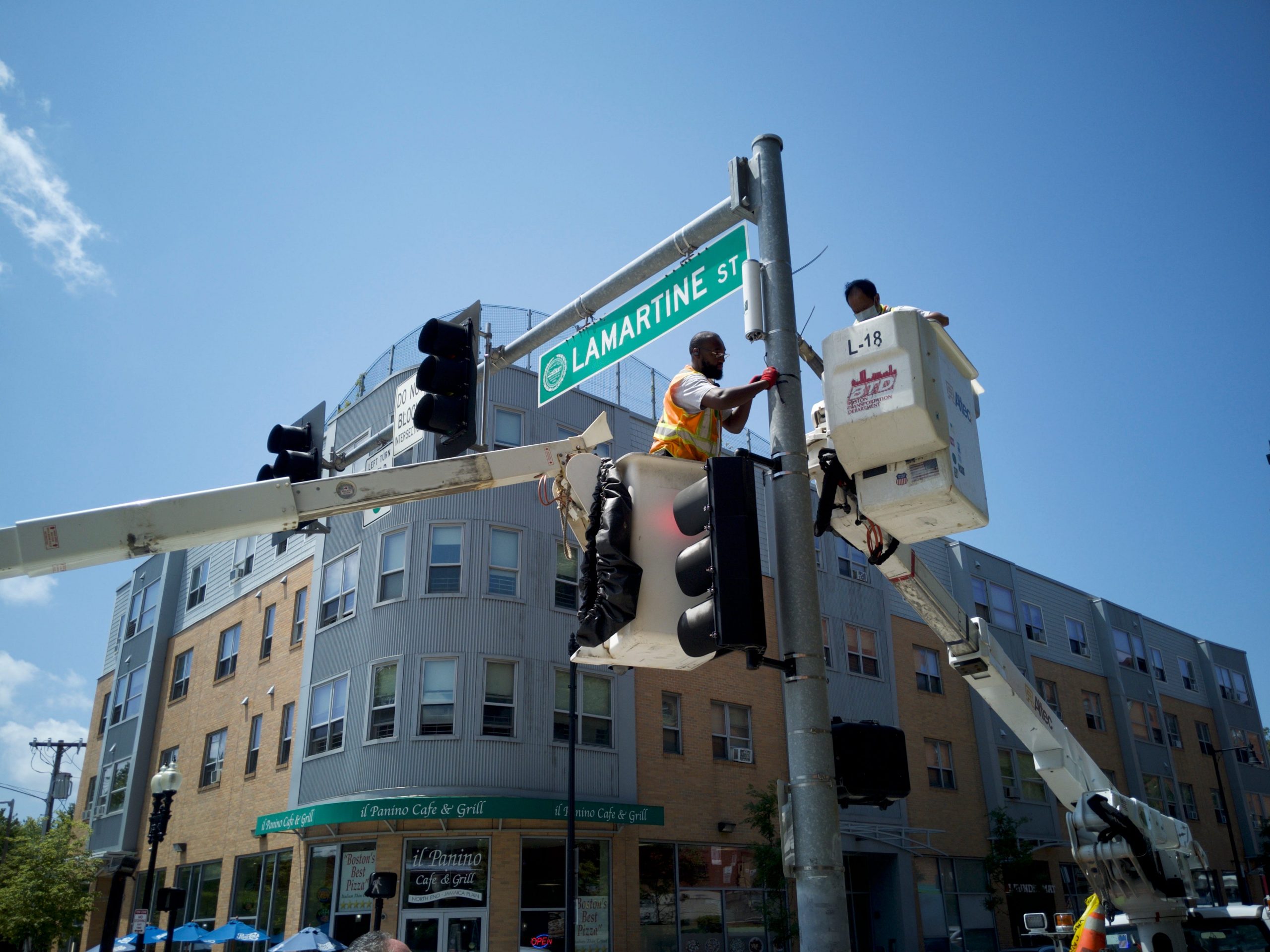 people working on a street in Boston