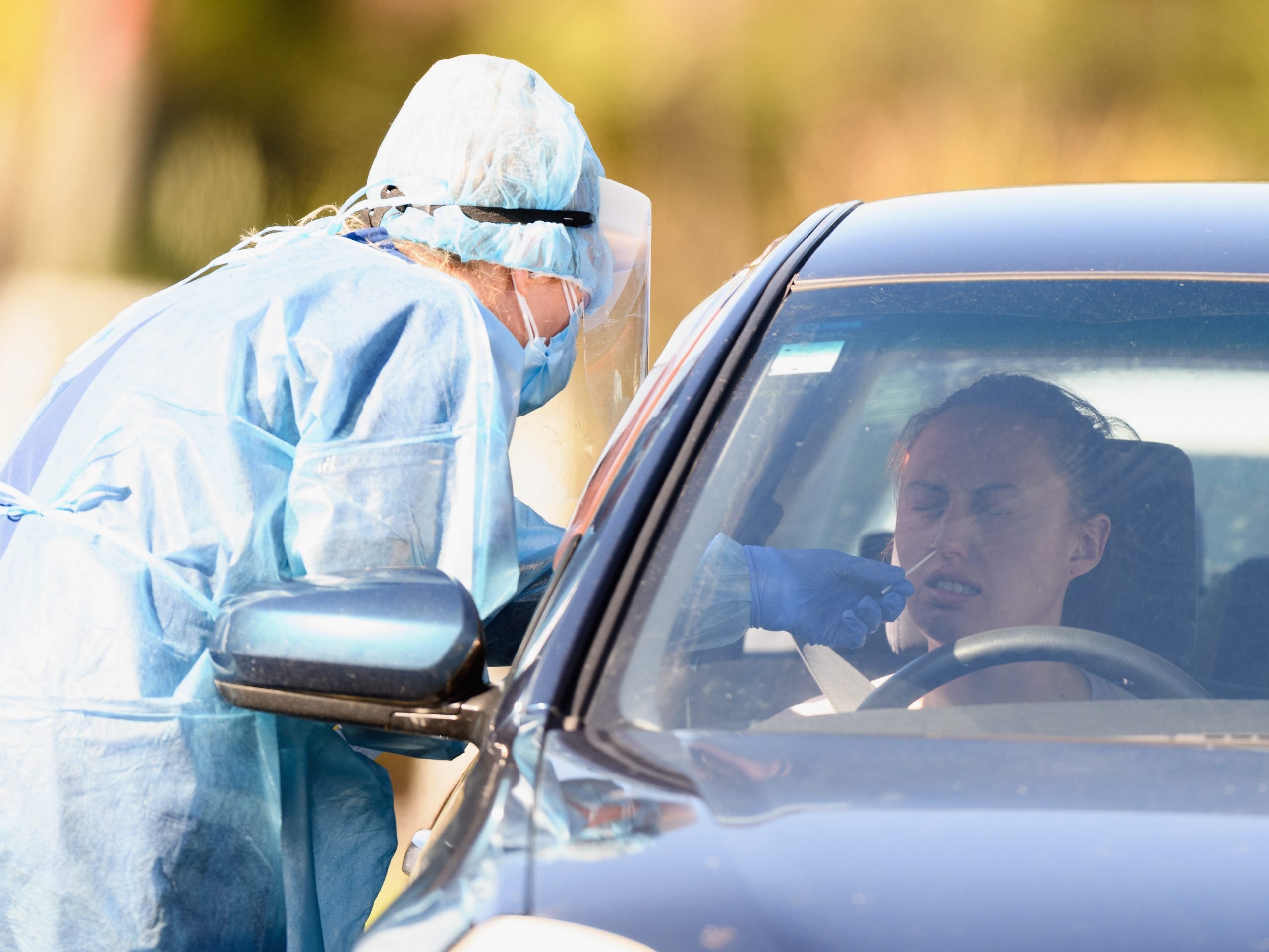 A person undergoes a swab test at the Pages Road drive through COVID-19 Testing Centre on August 21, 2021 in Christchurch, New Zealand.