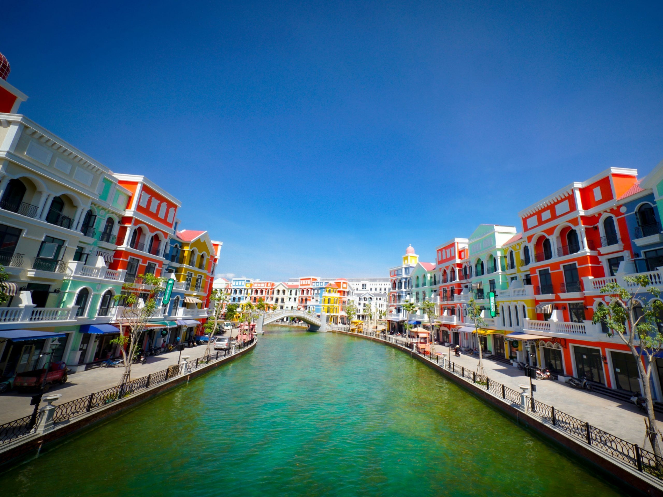 vietnam's fake venetian canal is lined with colorful buildings