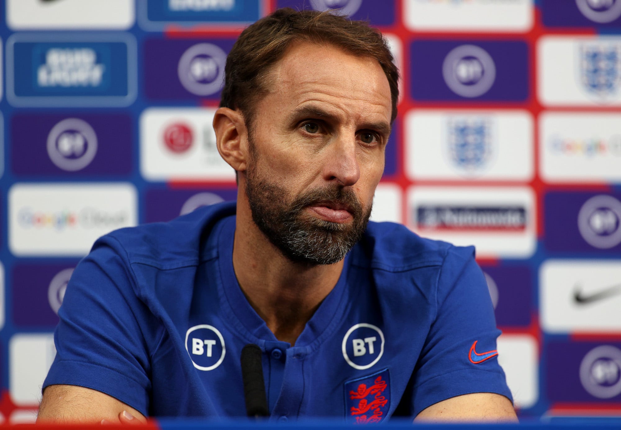 Gareth Southgate, Head Coach of England talks to the media during a press conference at St Georges Park