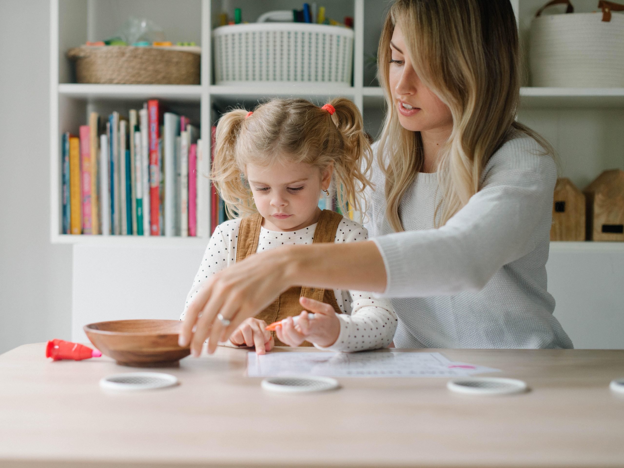 Justine LoMonaco teaching one of her daughters