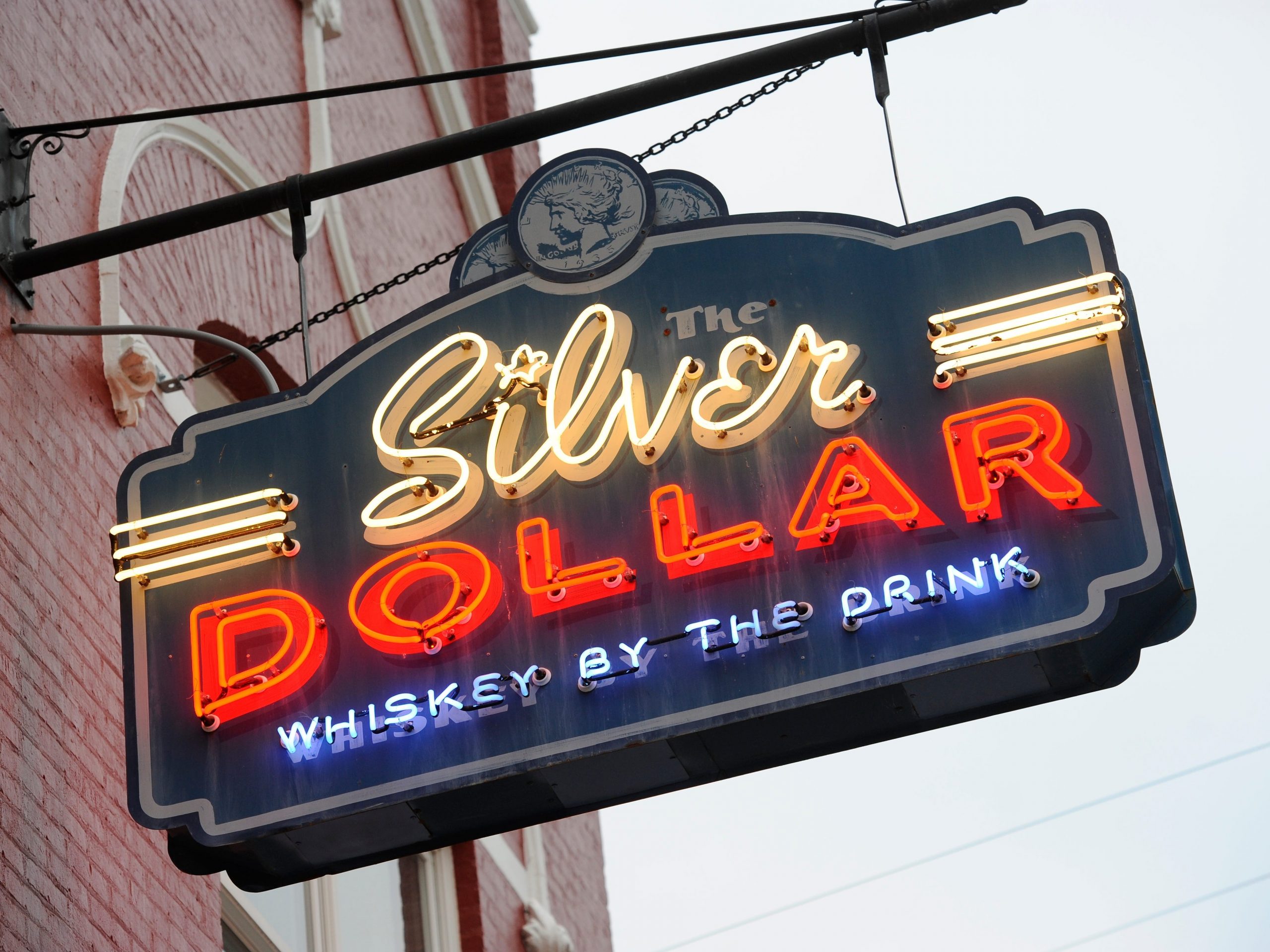 exterior shot of the neon sign in front of the silver dollar in louisville kentucky