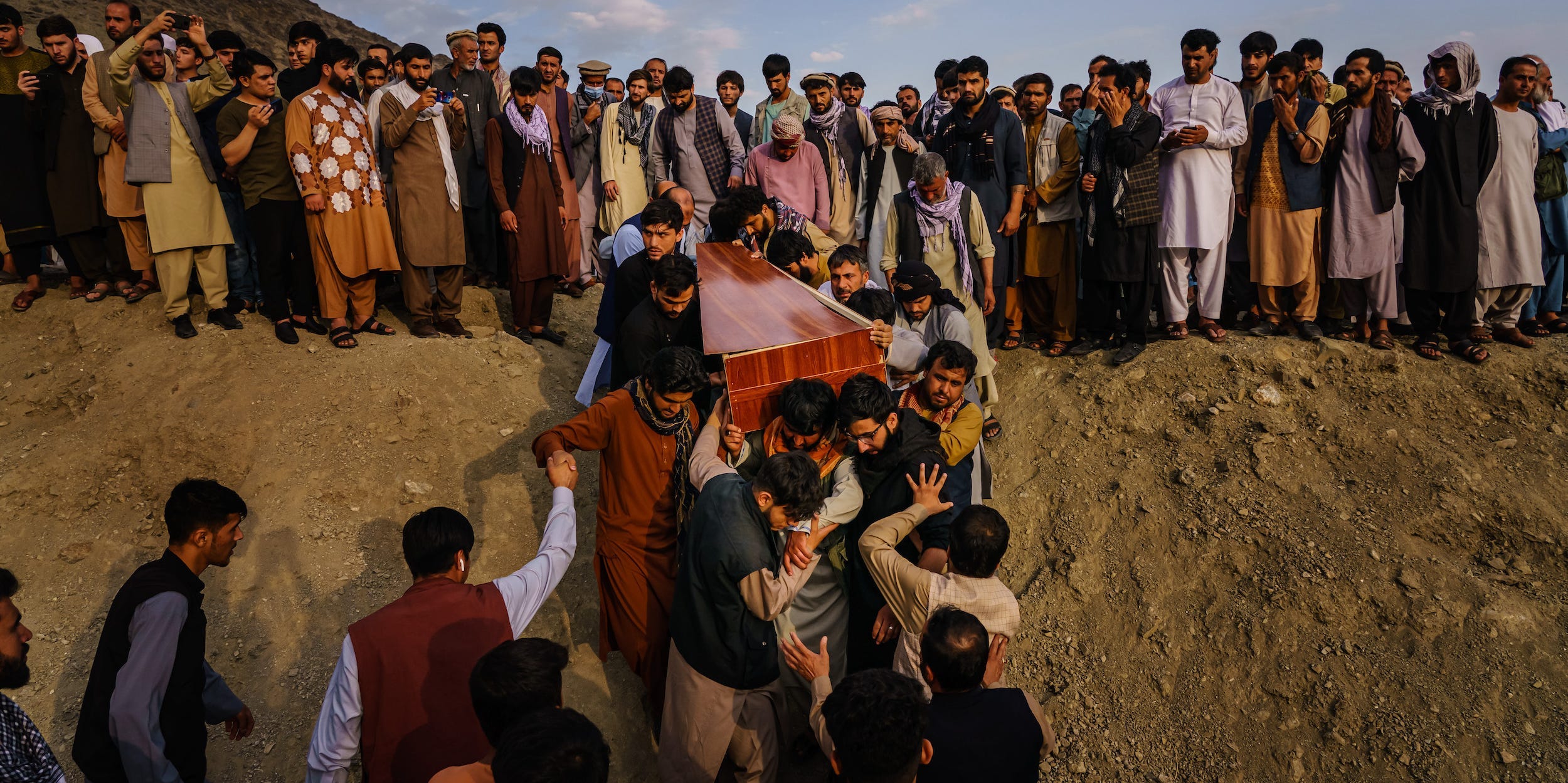 People carry a casket at a funeral in Afghanistan.