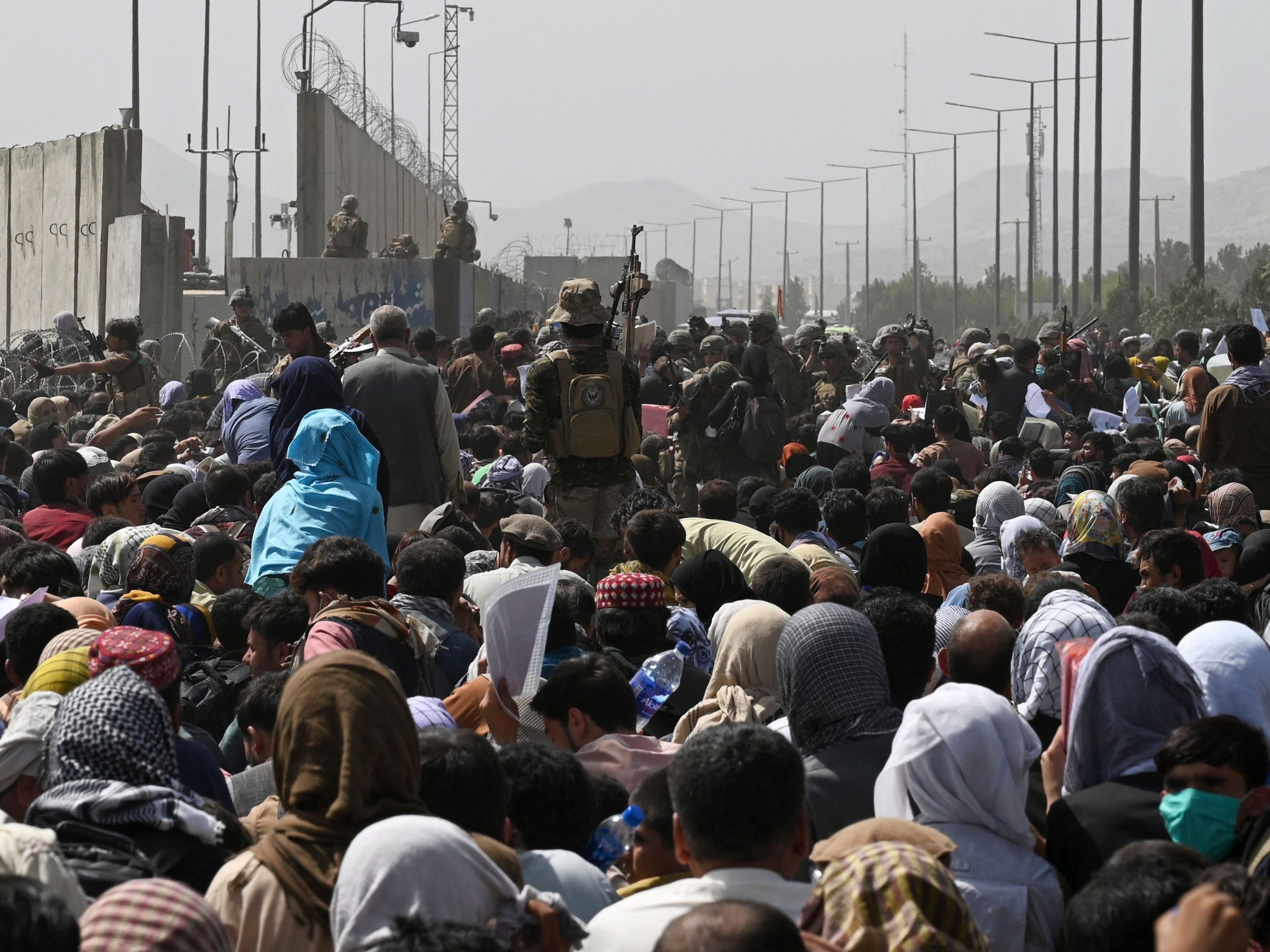 Thousands gather outside Kabul airport in hopes of getting on evacuation flight.