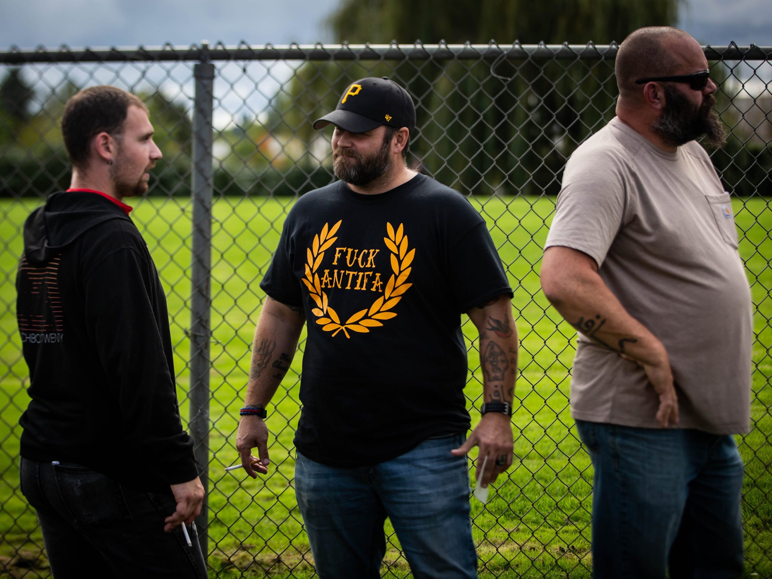 A man wears the black and yellow Proud Boys colors.