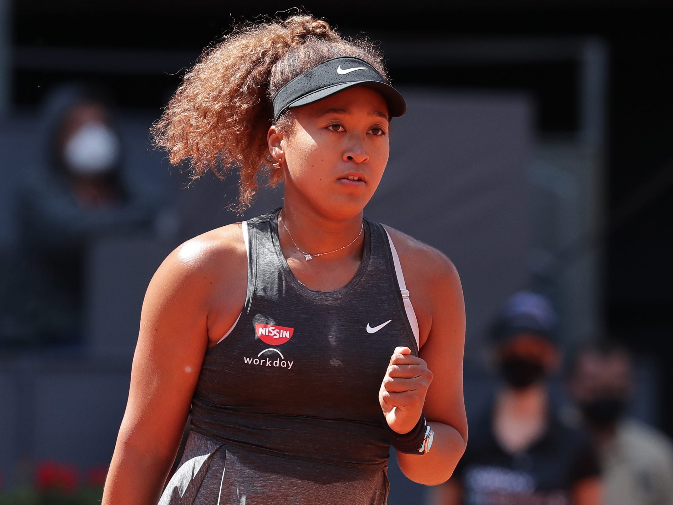 the tennis player Naomi Osaka on court