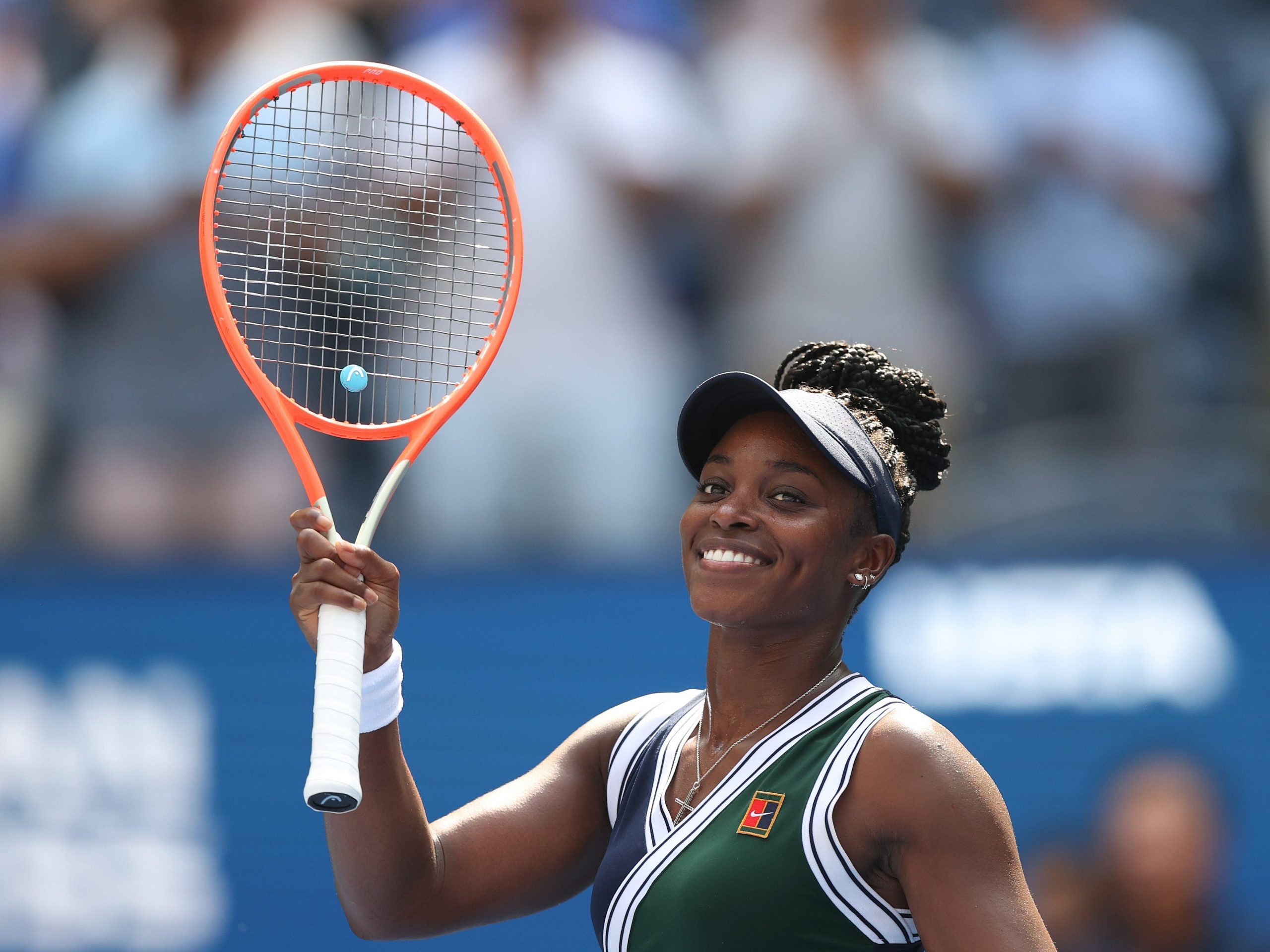 Sloane Stephens holds up her tennis racket while competing at the US Open.