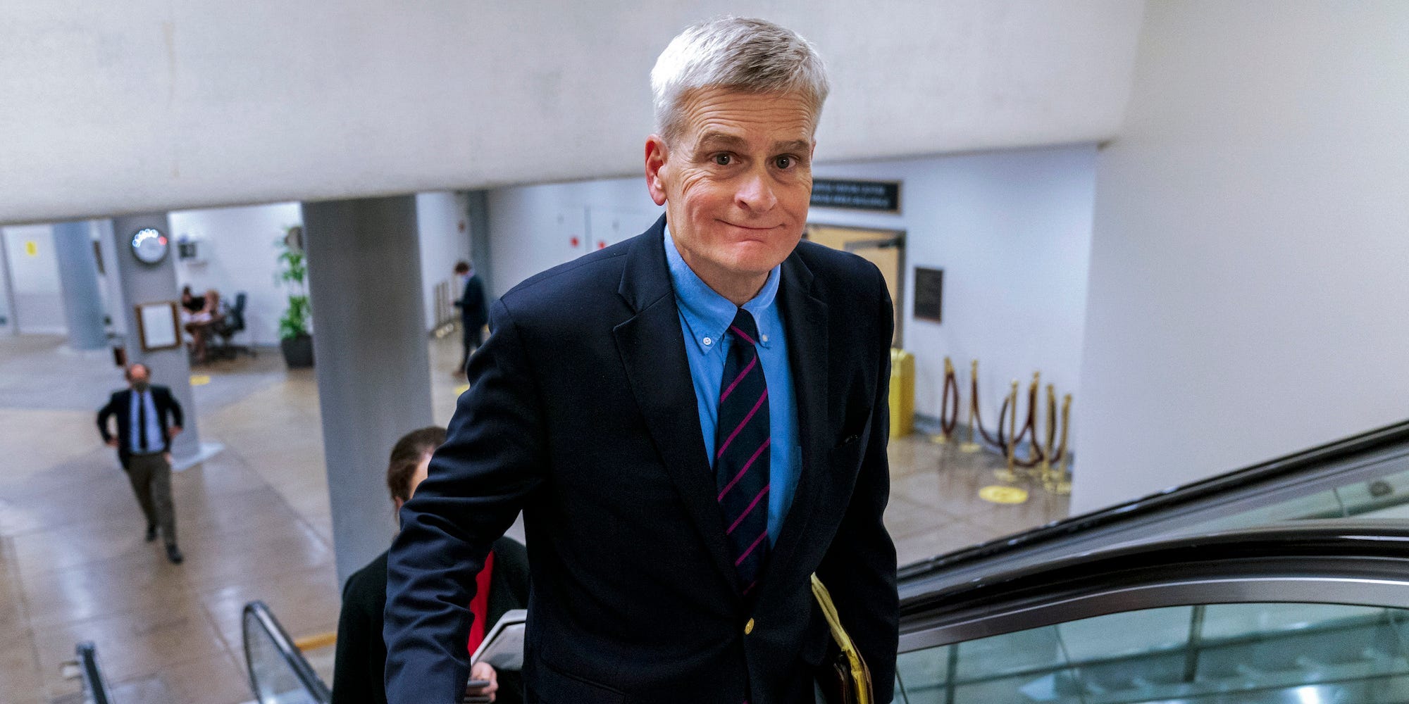 Sen. Bill Cassidy, R-La., takes an escalator from the Senate subway on Capitol Hill in Washington, Friday, July 30, 2021.