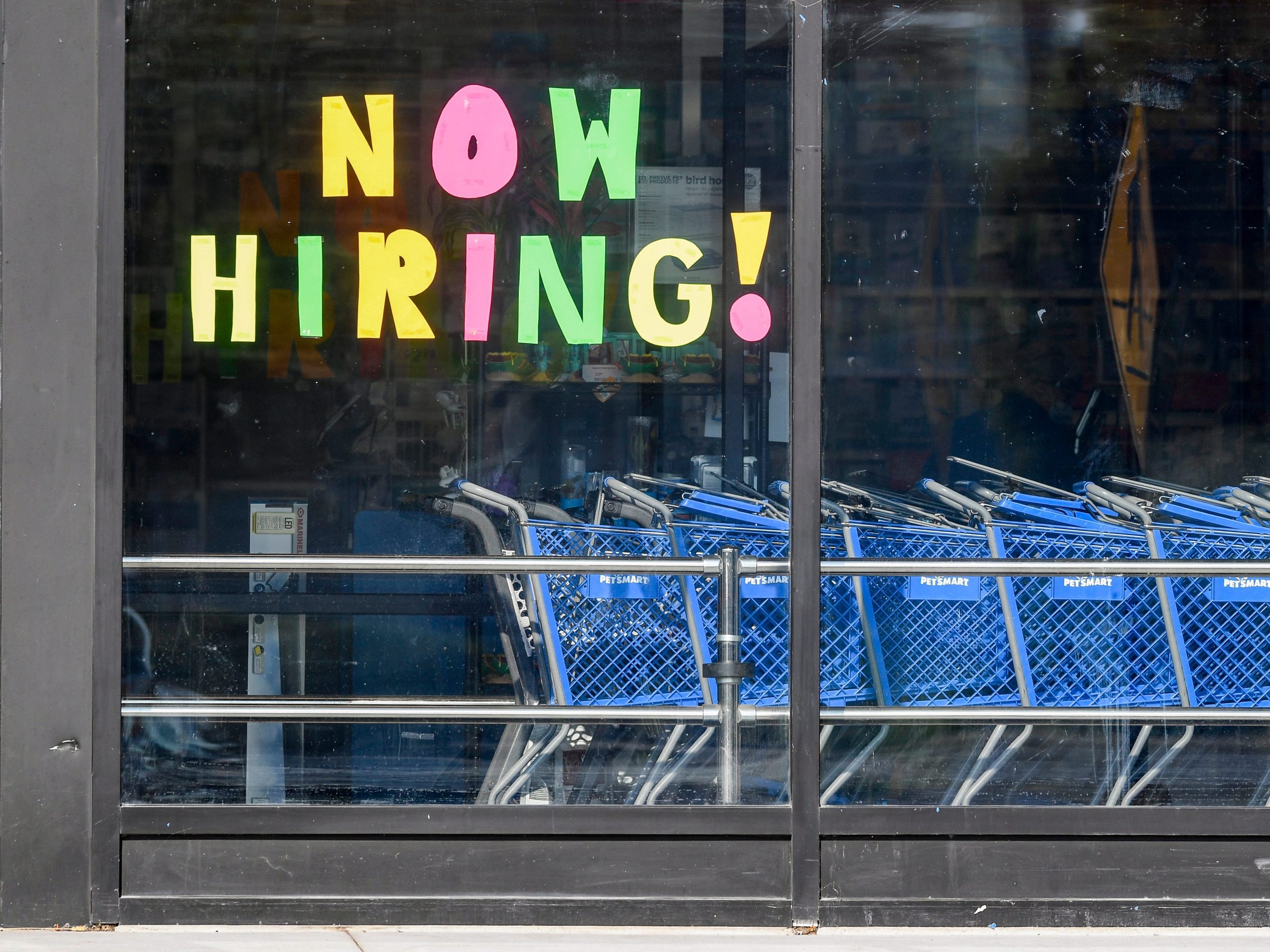 A help wanted sign that reads "Now Hiring!" in the window of the PetSmart location along 5th Street Highway in Muhlenberg Twp. Thursday morning August 26, 2021.