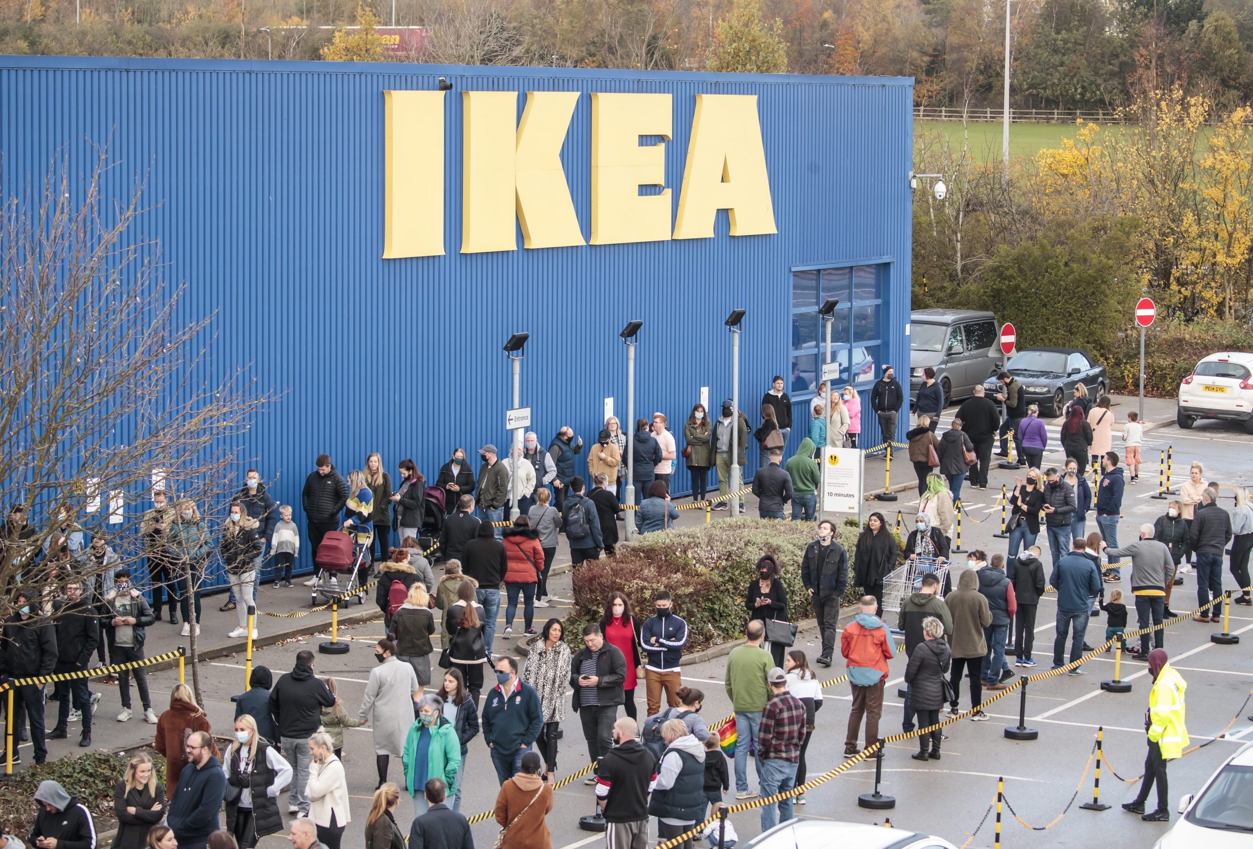 Shoppers queue outside Ikea store in West Yorkshire, UK.