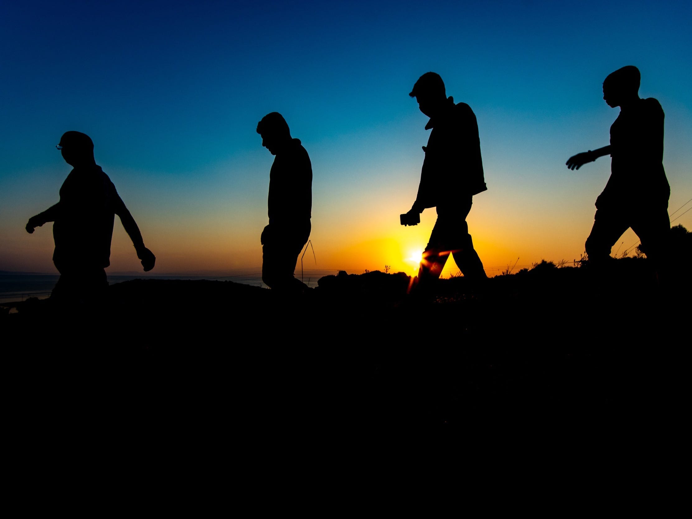 Afghanistan refugees walking at dawn