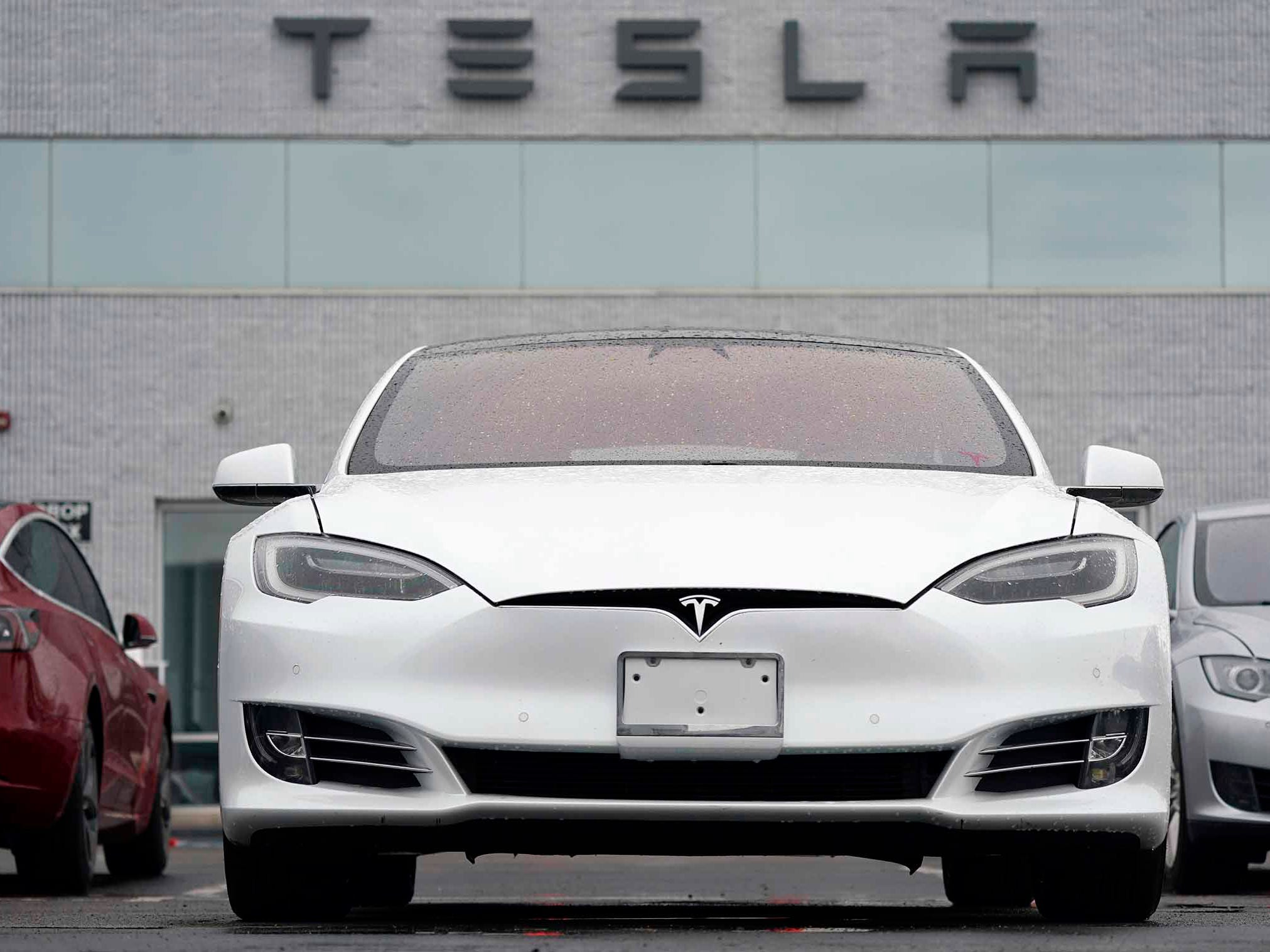 A white Tesla Model S is pictured at a Tesla facility in Littleton, Colorado.