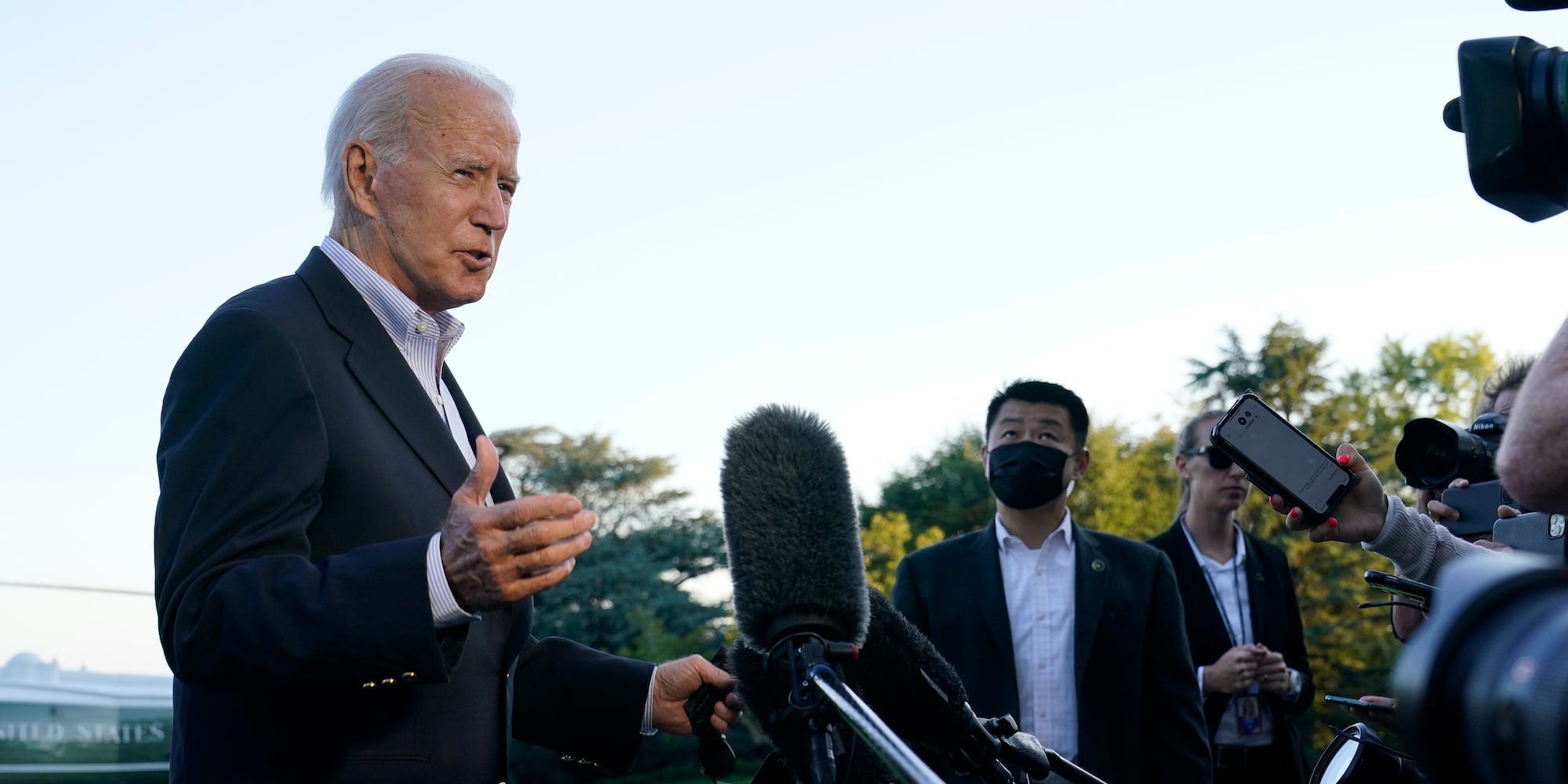 President Joe Biden talks with reporters after landing on Marine One on the South Lawn of the White House in Washington, Tuesday, Sept. 7, 2021, after returning from a trip to New York and New Jersey to survey damage from the remnants of Hurricane Ida.