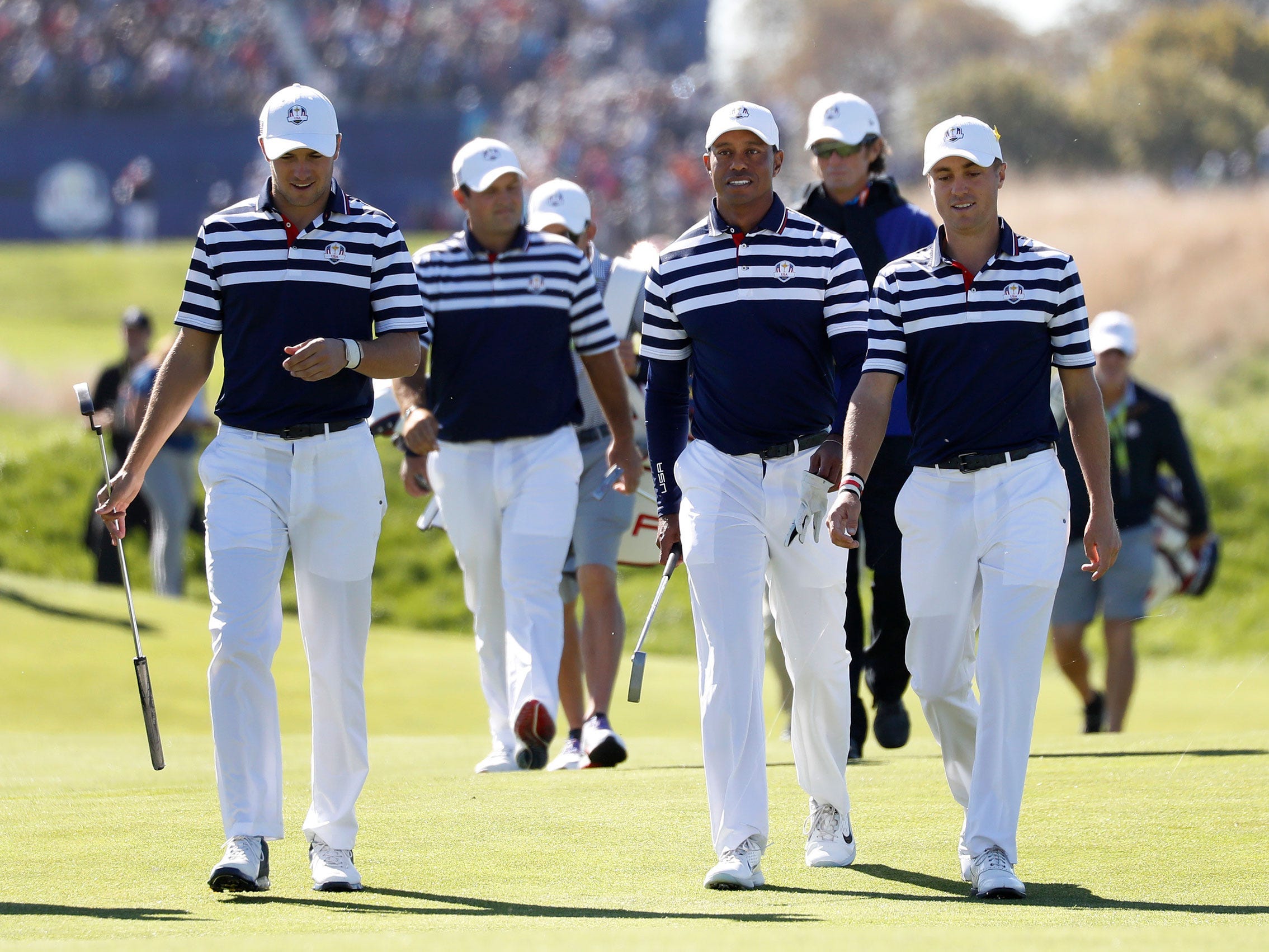 Members of the 2018 Ryder Cup team walk the course.