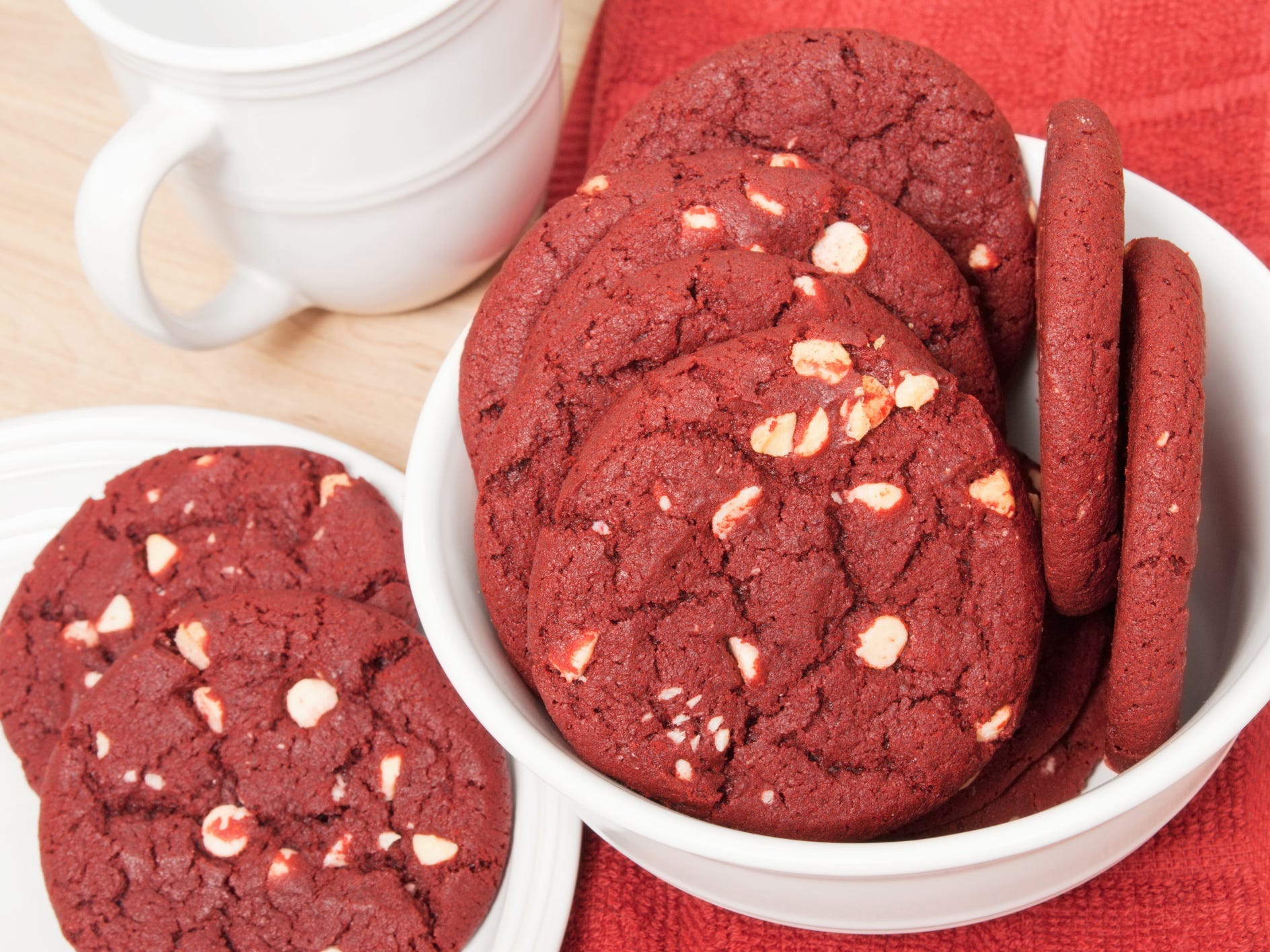 Red velvet cookies in a bowl and on a plate.