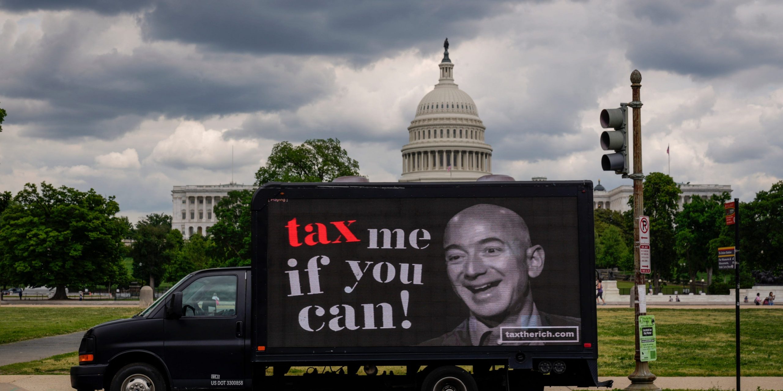 A mobile billboard calling for higher taxes on the ultra-wealthy depicts an image of billionaire businessman Jeff Bezos, near the U.S. Capitol on May 17, 2021 in Washington, DC. Organized by the group "Patriotic Millionaires," the mobile billboards are rolling through Washington, DC and New York City on Monday to mark Tax Day, calling for higher taxes for wealthy Americans.