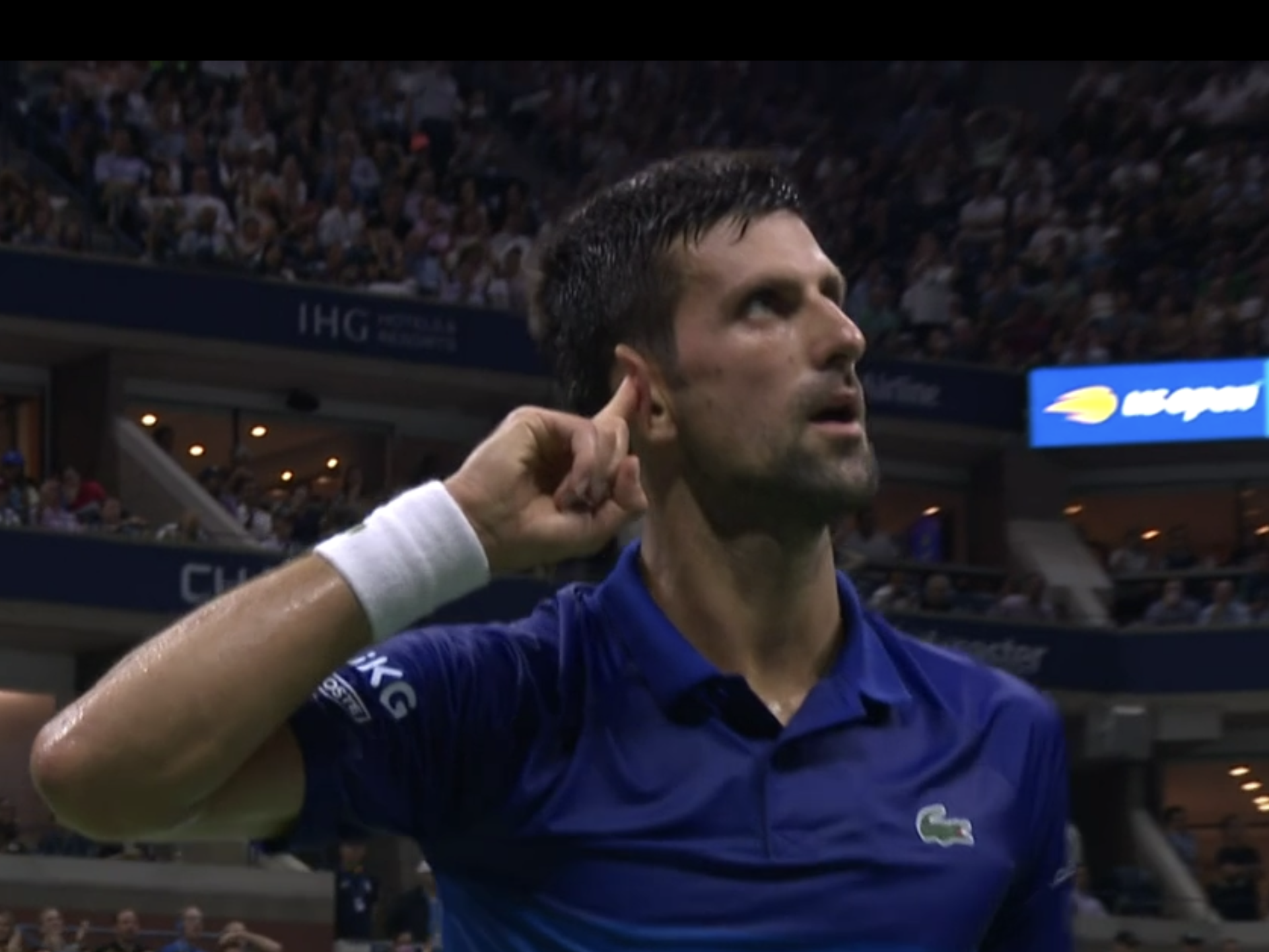 Djokovic glares at the crowd after winning a point at the US Open