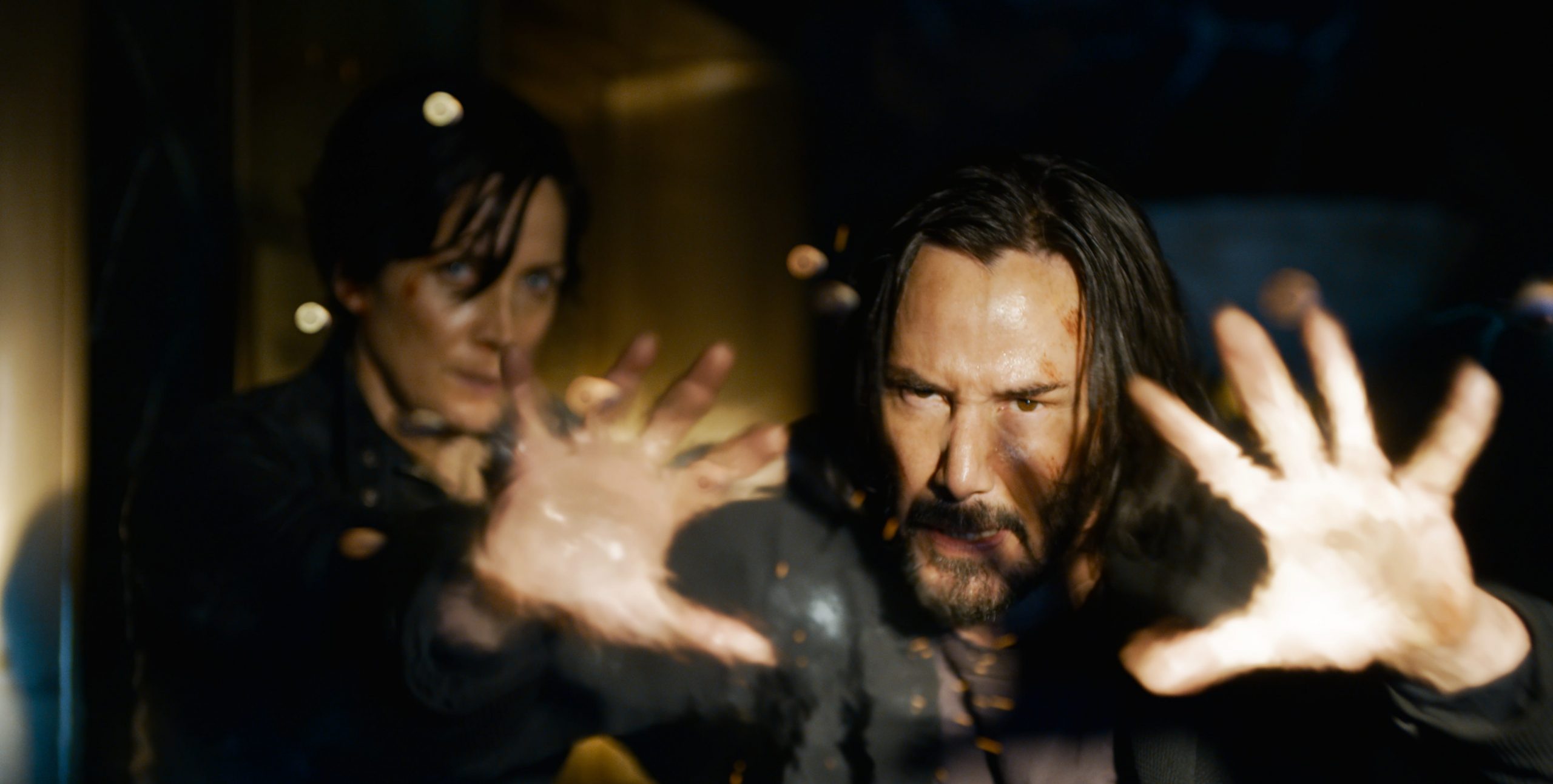 Carrie-Ann Moss and Keanu Reeves prepairing for battle