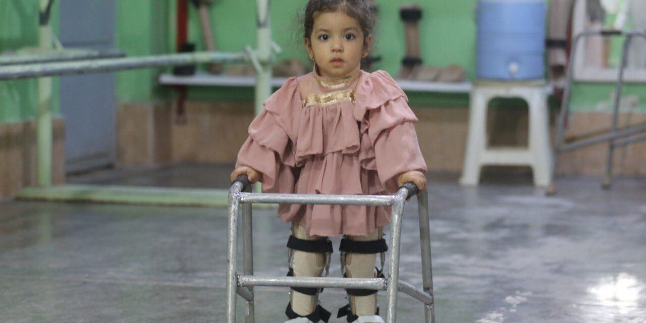 A physically disabled girl walks with a walker at the physically disabled center of the International Committee of the Red Cross in Herat, Afghanistan on September 02, 2021. The center is the only disability support center in Afghanistan.