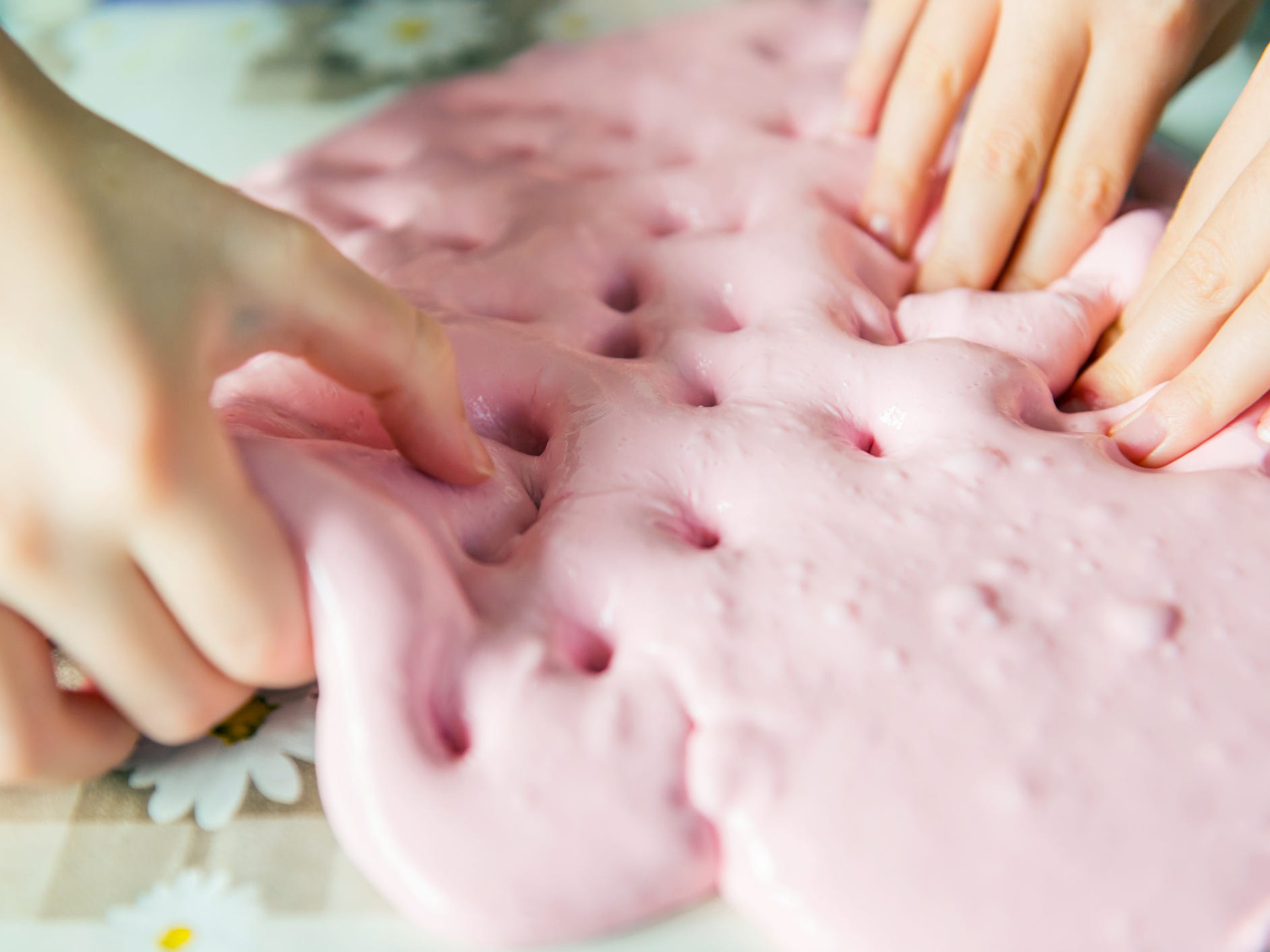 People playing with pink slime.