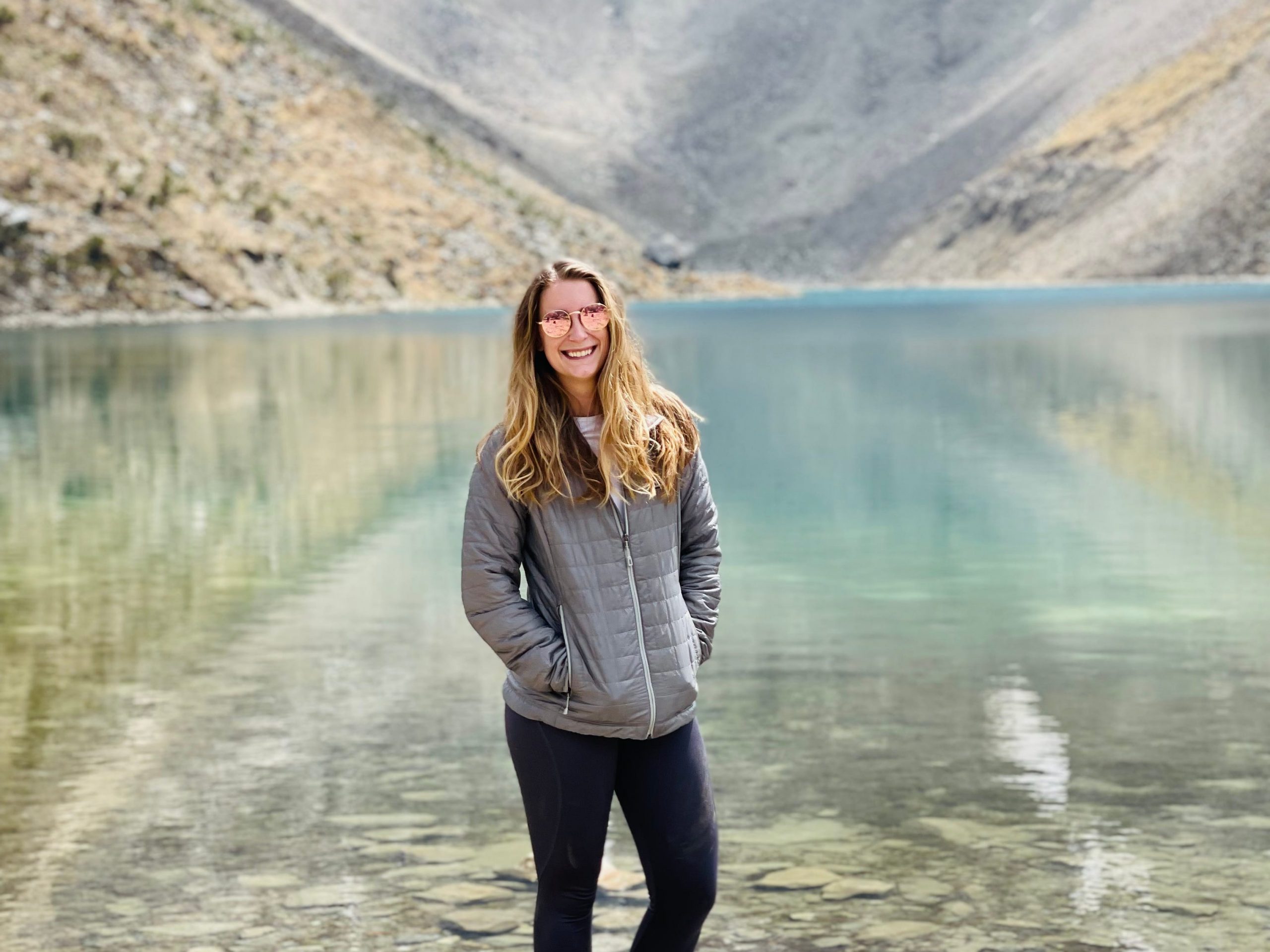 Shelby Farnsworth by a mountain lake