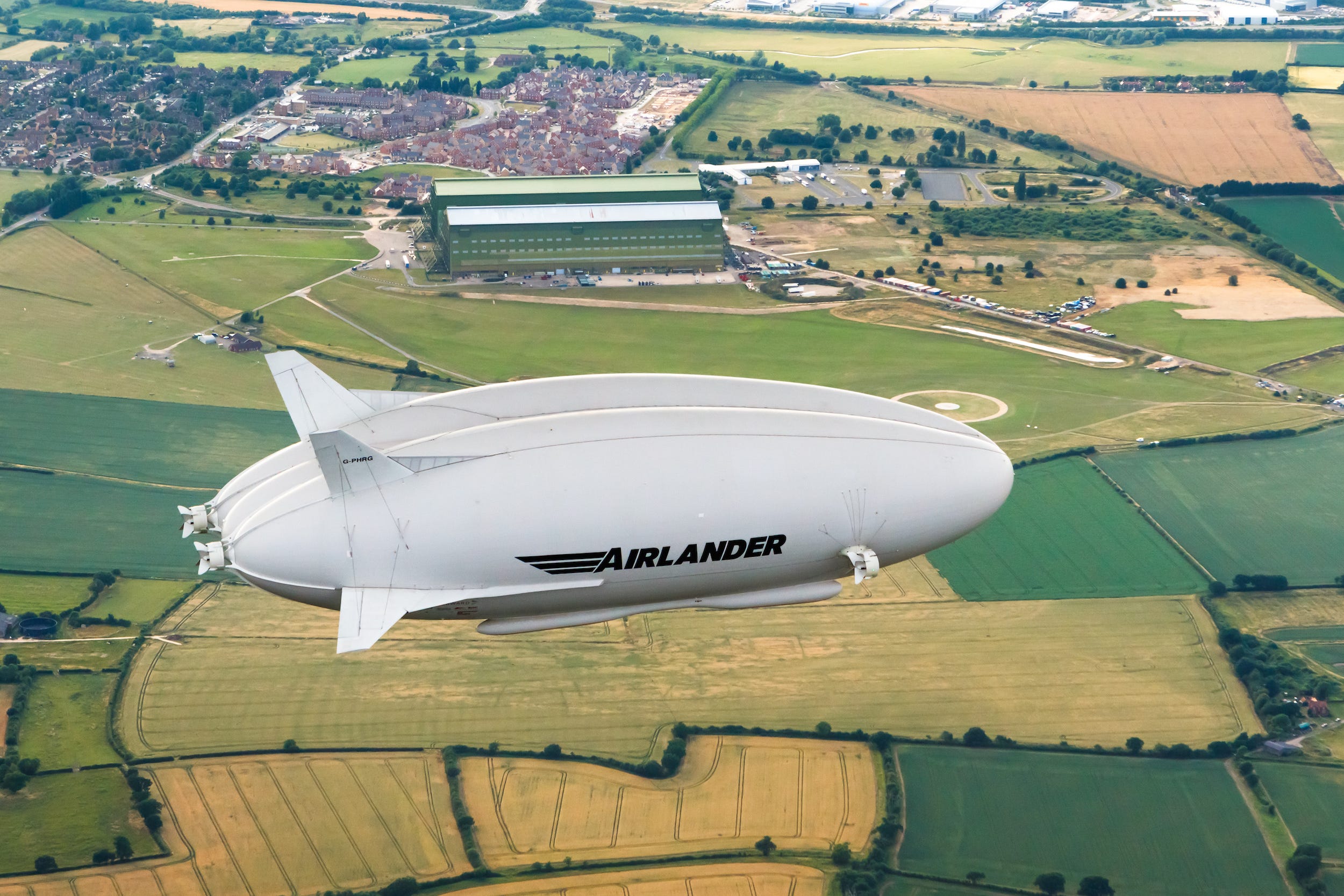 The Airlander 10 flying over fields