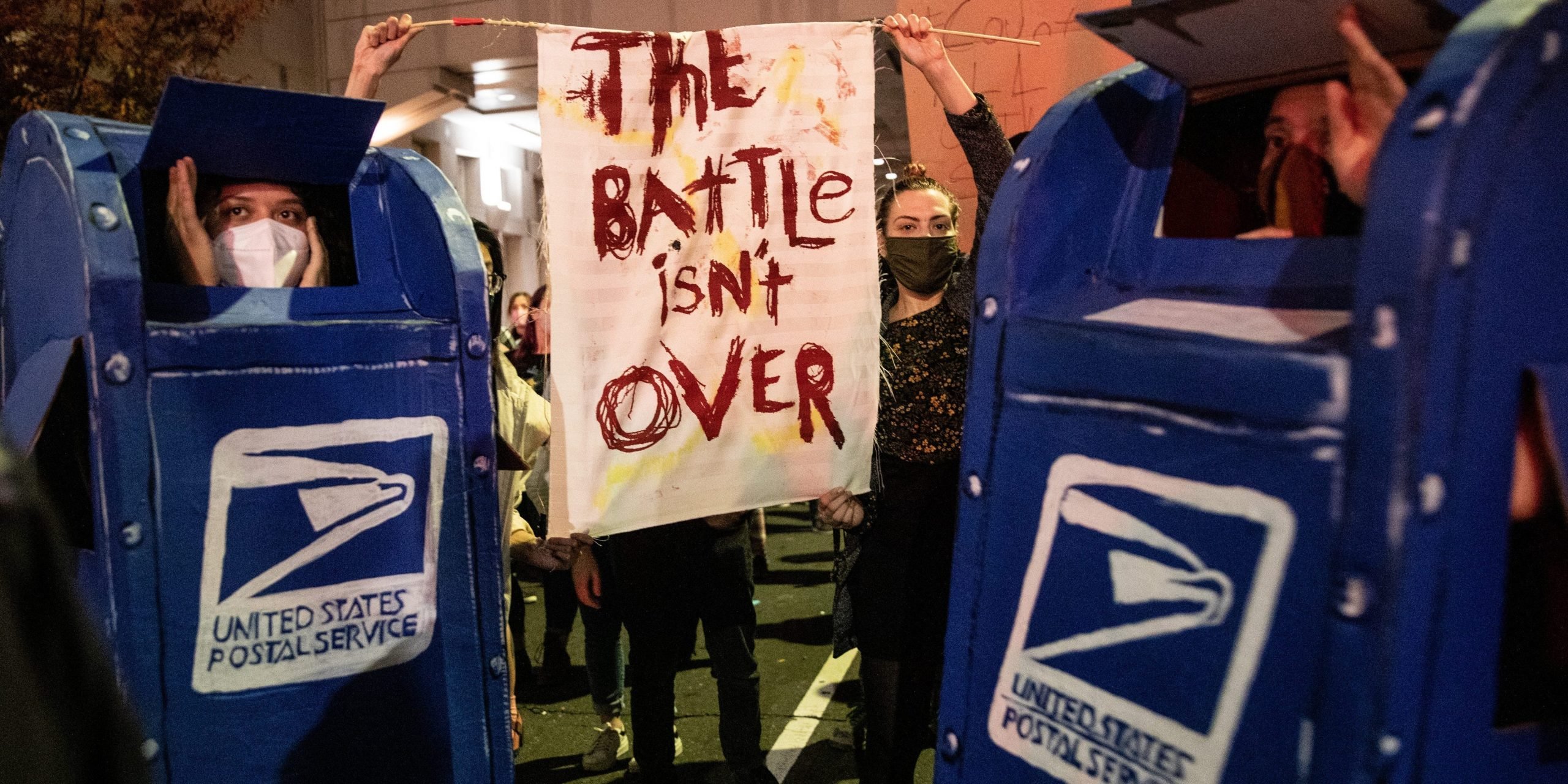 Protesters dressed as post office boxes.