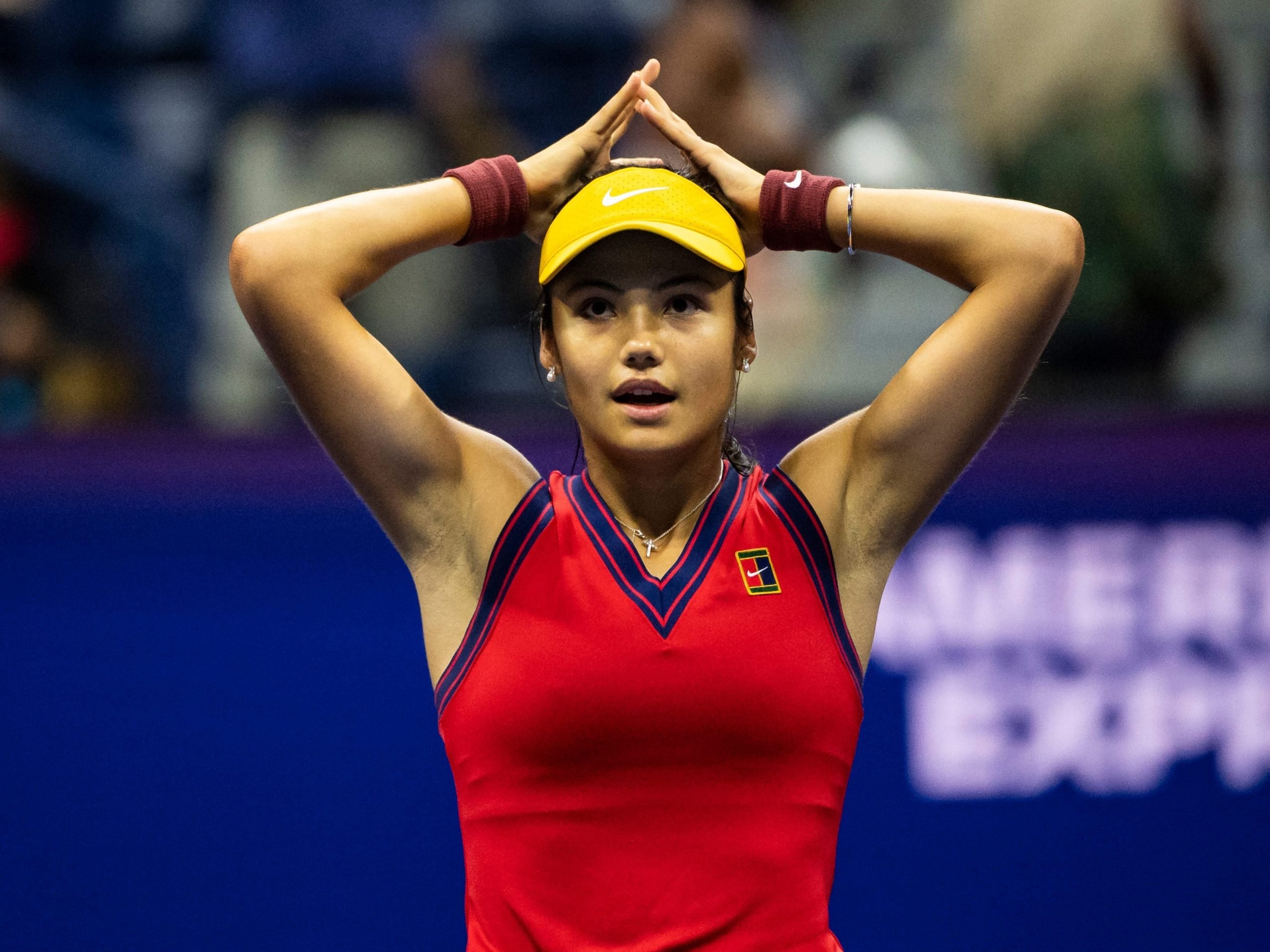 Emma Raducanu raises her hands to her head after reaching the US Open final