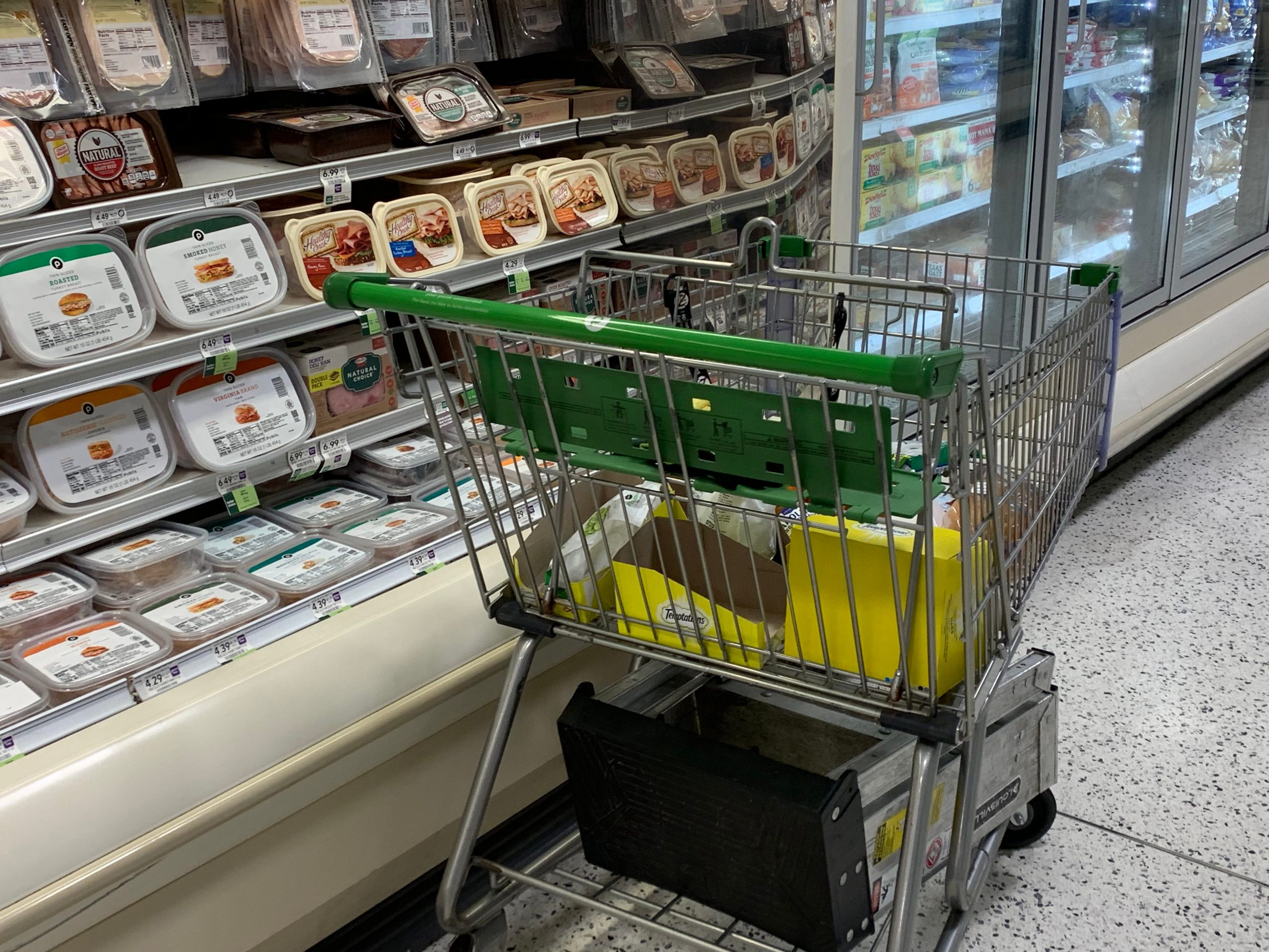 A cart in Publix with items inside