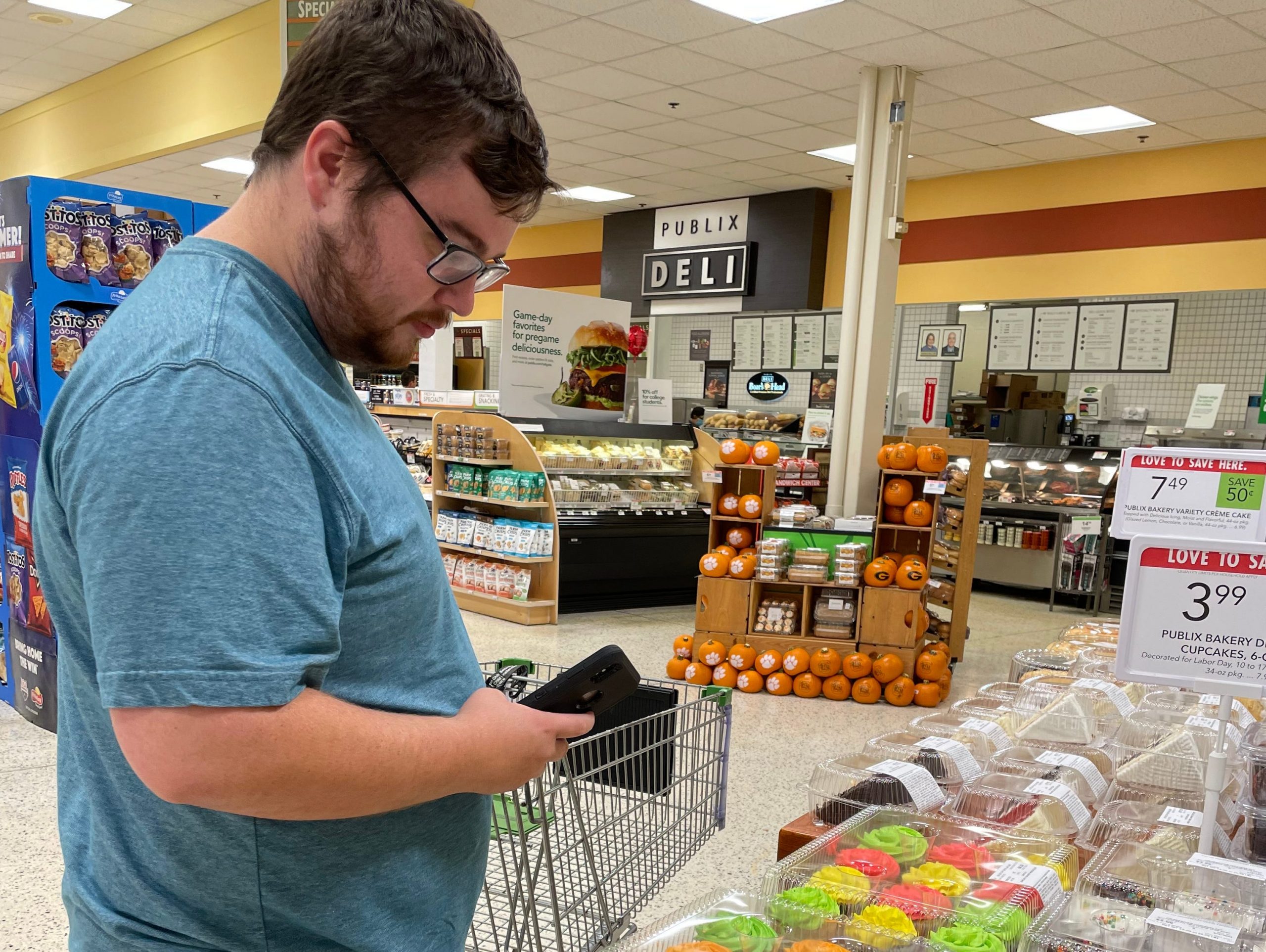 The writer looking at desserts in a Publix