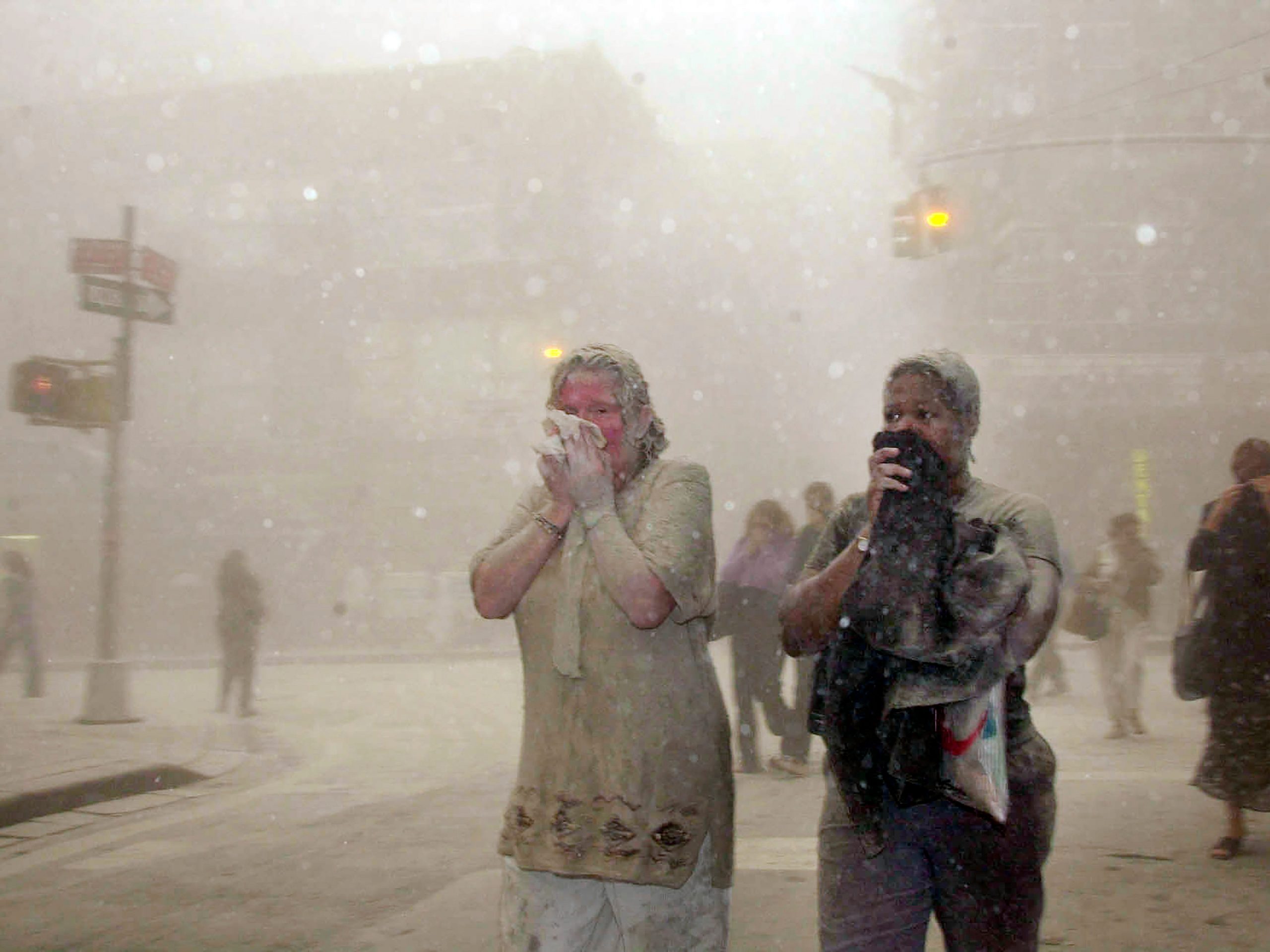 File photo of people covered in dust on September 11