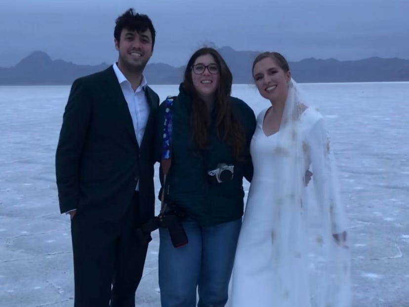 cameron dever posing for a photo with a couple